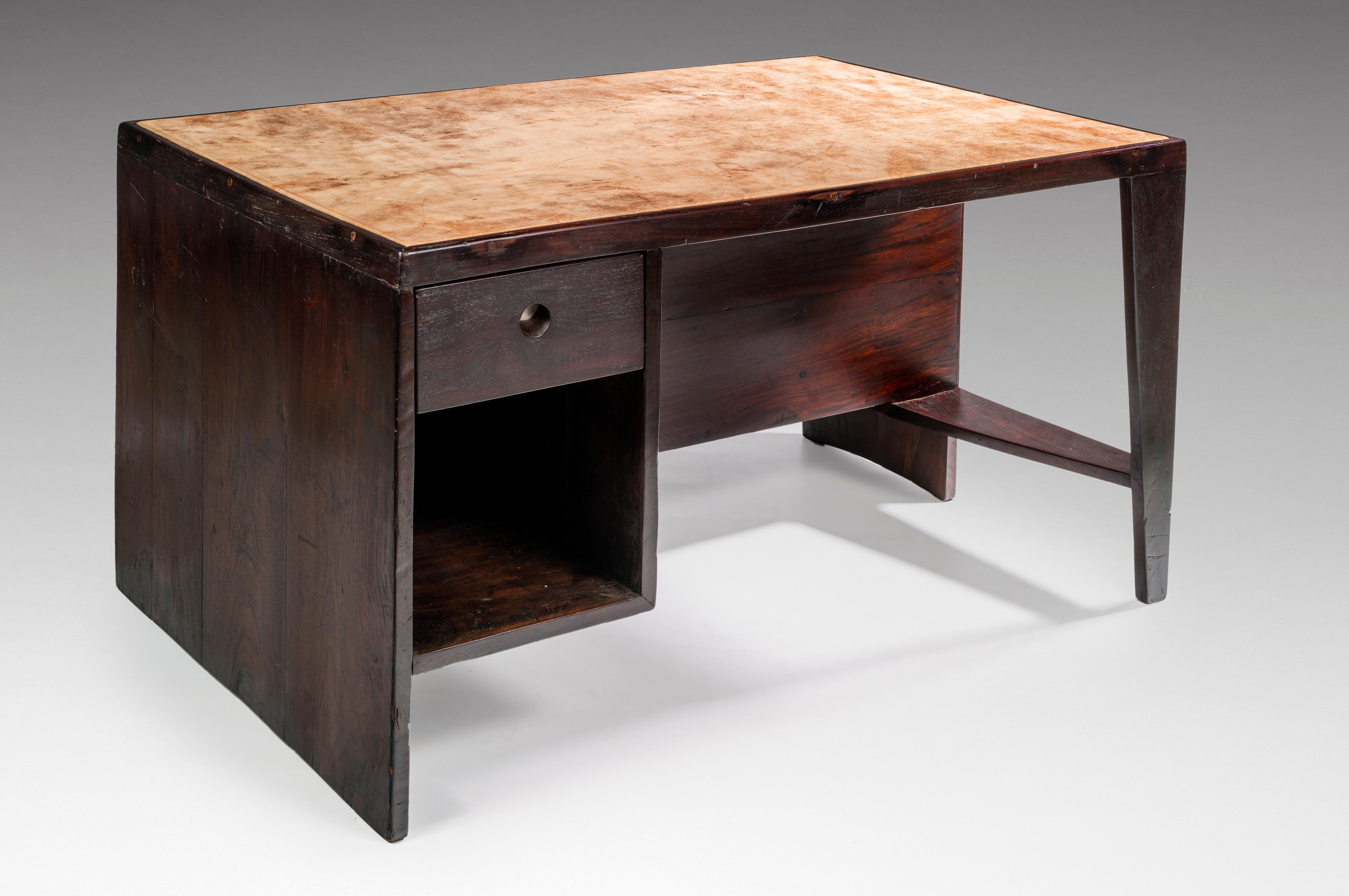 Pierre Jeanneret
PJ-BU-02-A

Important: Vintage collector's item for sale with guaranteed authenticity. 

Desk-bookcase called “Office table”, circa 1957-1958
Tabletop fixed on a spindle leg and a solid bloc and comprising on the user’s side a