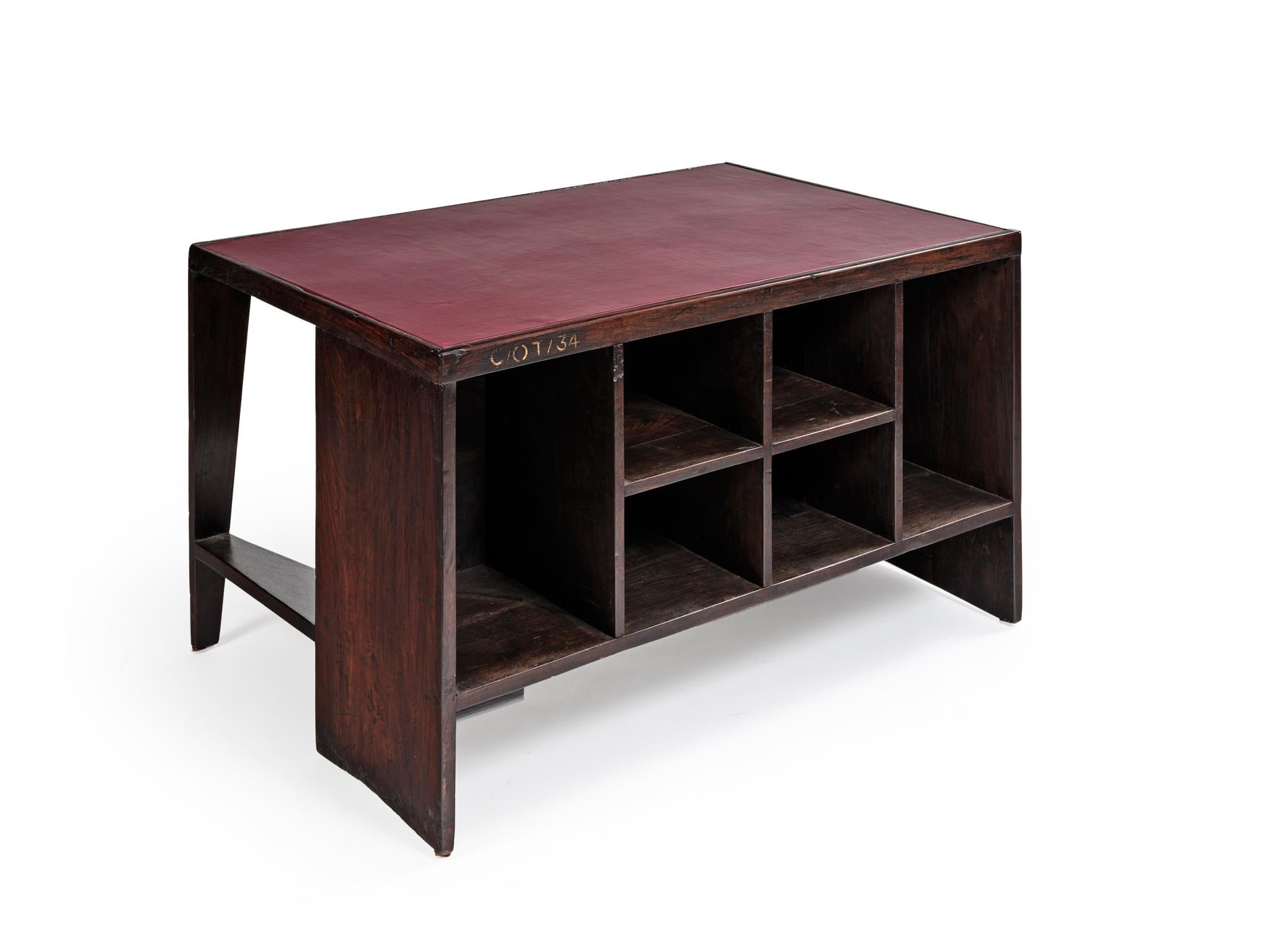 Pierre Jeanneret
PJ-BU-02-A

Important: Vintage collector's item for sale with guaranteed authenticity. 

Desk-bookcase called “Office table”, circa 1957-1958
Tabletop fixed on a spindle leg and a solid bloc and comprising on the user’s side a