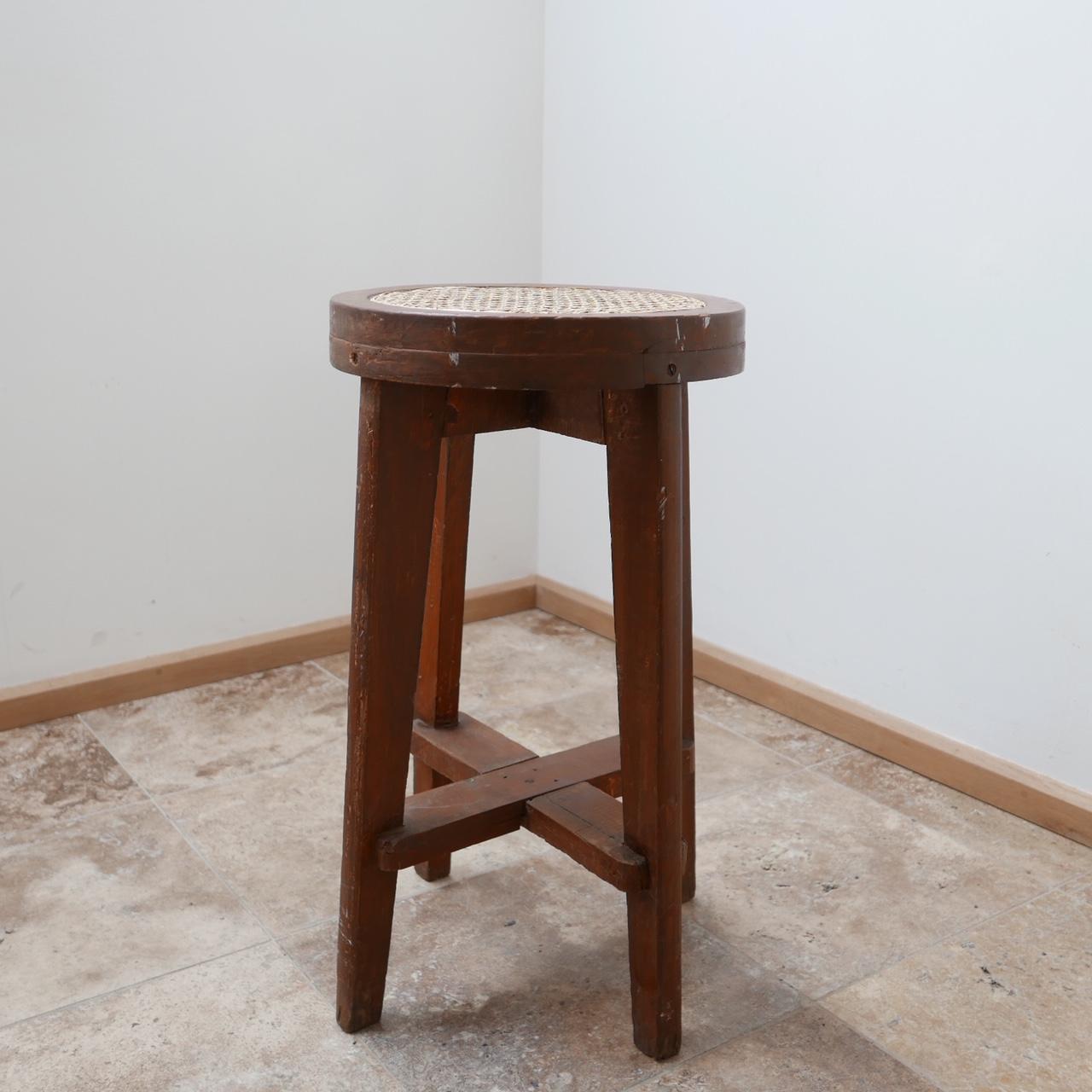 A lab stool by French design legend Pierre Jeanneret.

Teak and cane.

In original unpolished condition.

Highly collectable and increasingly scarce.

India, circa 1965 for Chandigarh.

Vintage condition.

Dimensions: 38 D, 68 H.