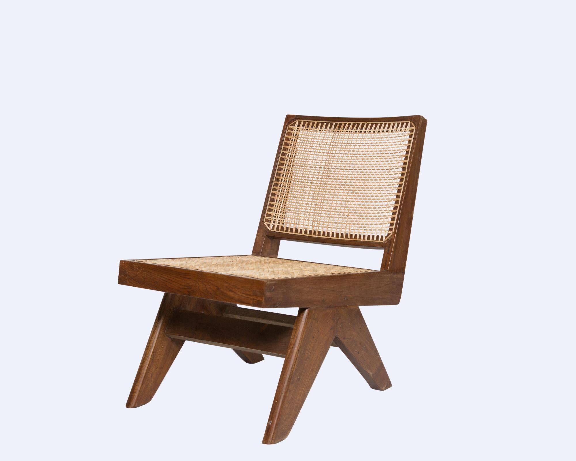 Pierre Jeanneret pair of armless easy chairs of teak
• Excellent condition for age
• Includes certificate of authenticity, certified by Jacques Dworczak, world-renowned Pierre Jeanneret authenticator and collector, author of the Assouline book