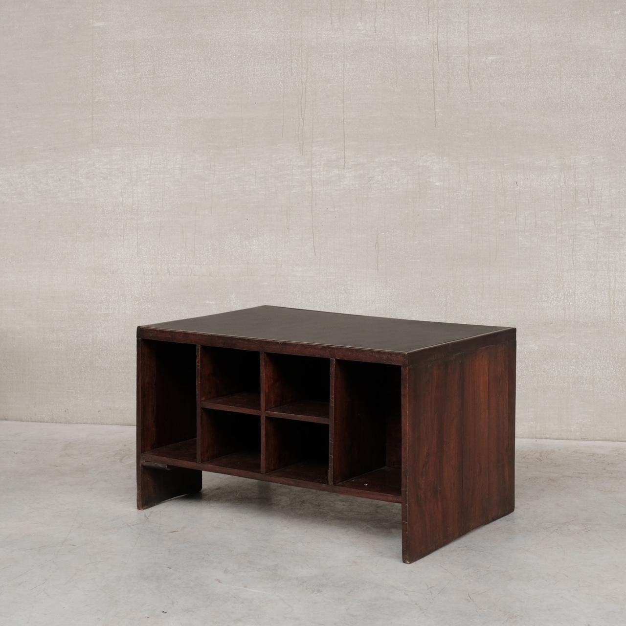 An increasingly scarce teak mid-century desk by legendary design Pierre Jeanneret. 

India, circa 1960s, for Chandigarh projects. 

Designed for various administrative buildings in the city. 

Black re-covered leather top. A single drawer to