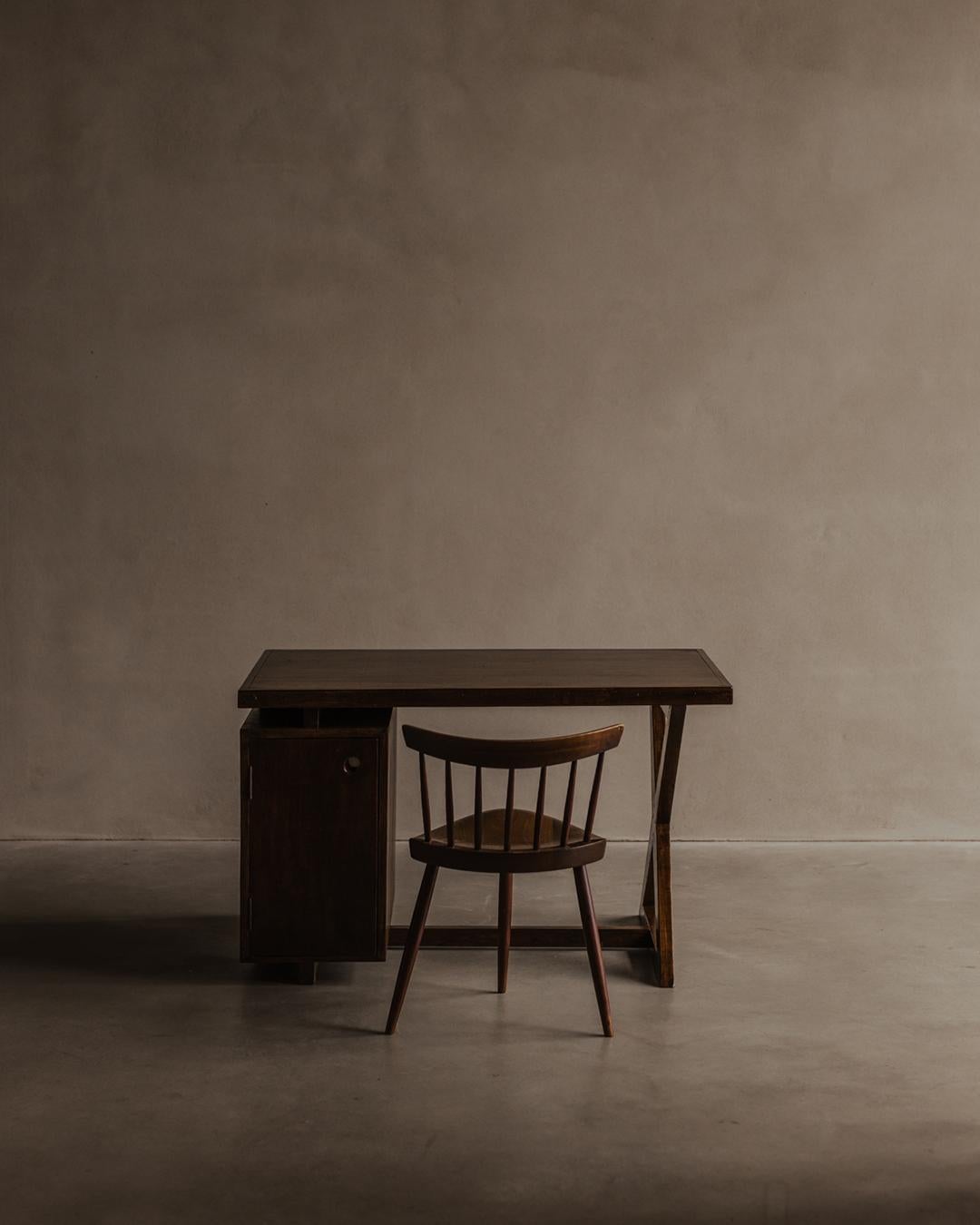 Administrative desk, circa 1960, made for the city of Chandigarh, India. Also known as the PJ-BU-19-A desk. 
Top fixed on an “X” leg. One side has a small single cabinet door with aluminum detail. The other side four drawers with aluminum recessed
