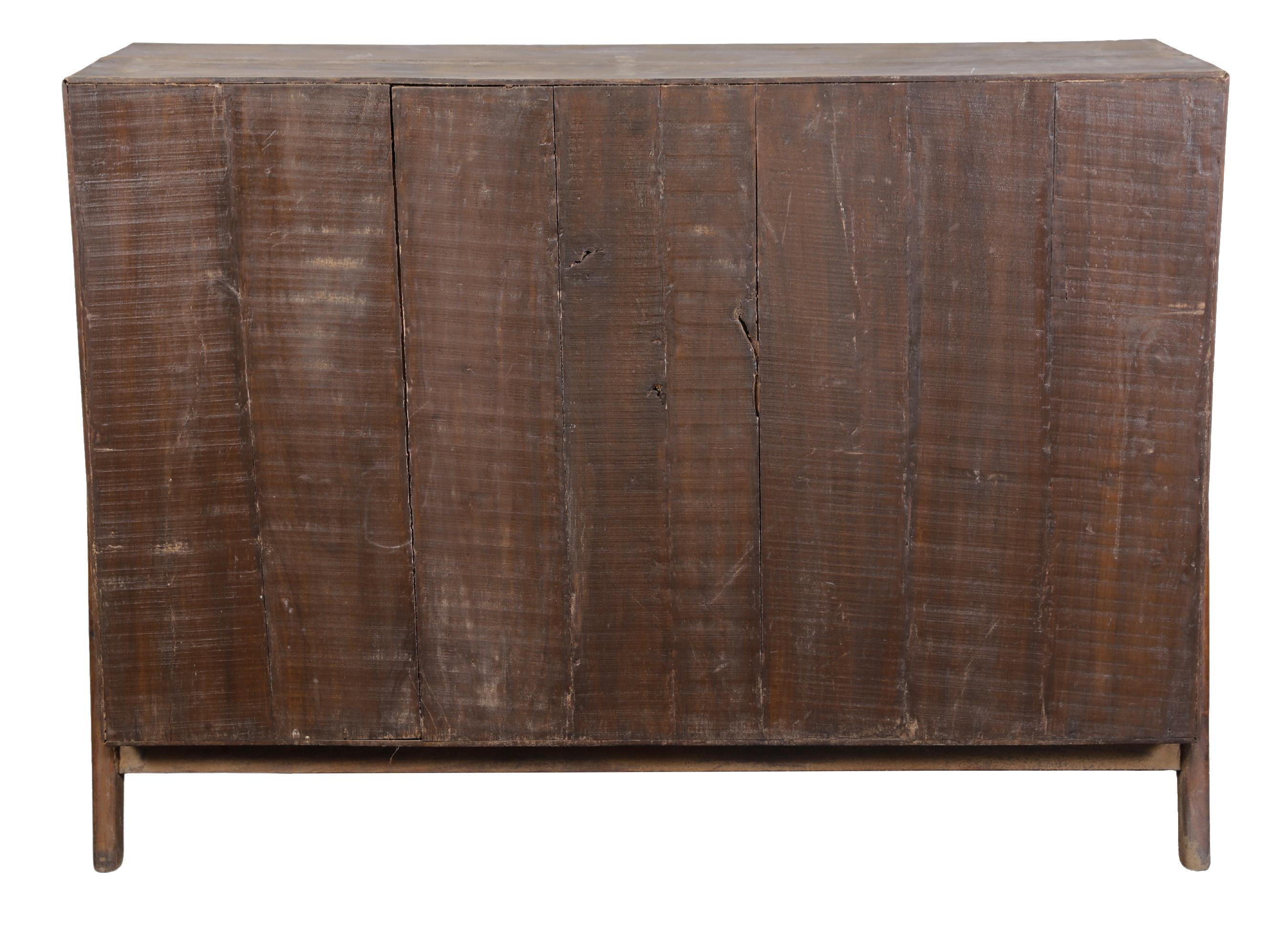 An incredible solid teak example of the iconic PJ-R-01-C sideboard.    This piece is in incredible sympathetically restored condition.   Three small drawers on the top , two large doors on left, and four more smaller shelves to the right.    
A