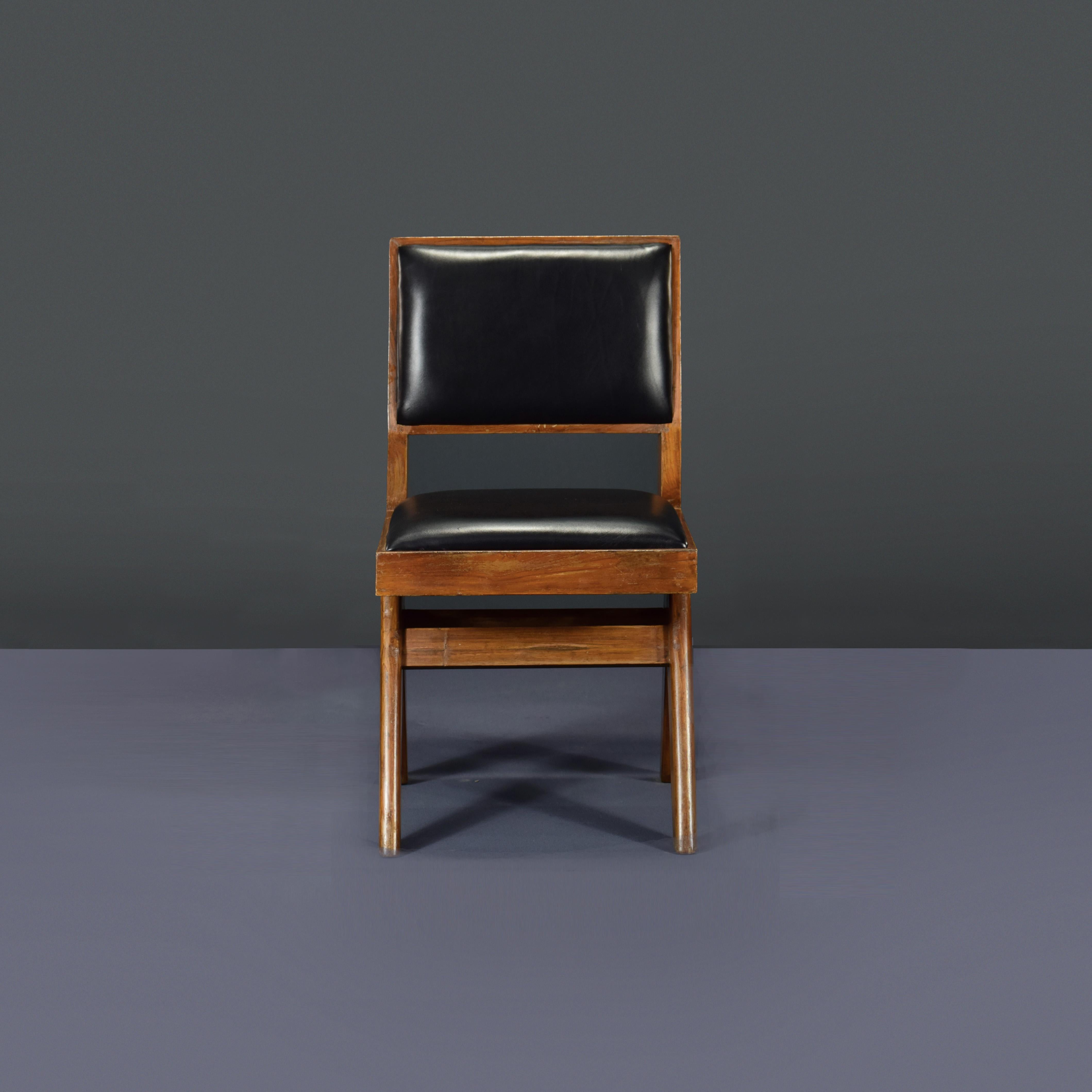 This chair is a very rare student chair with upholstery. Finally, it's iconic. It appears so simple and yet so precise, where proportions seems to be perfect. This A-shaped legs are typical for Chandigarh objects. Then this l-shaped seat, where the