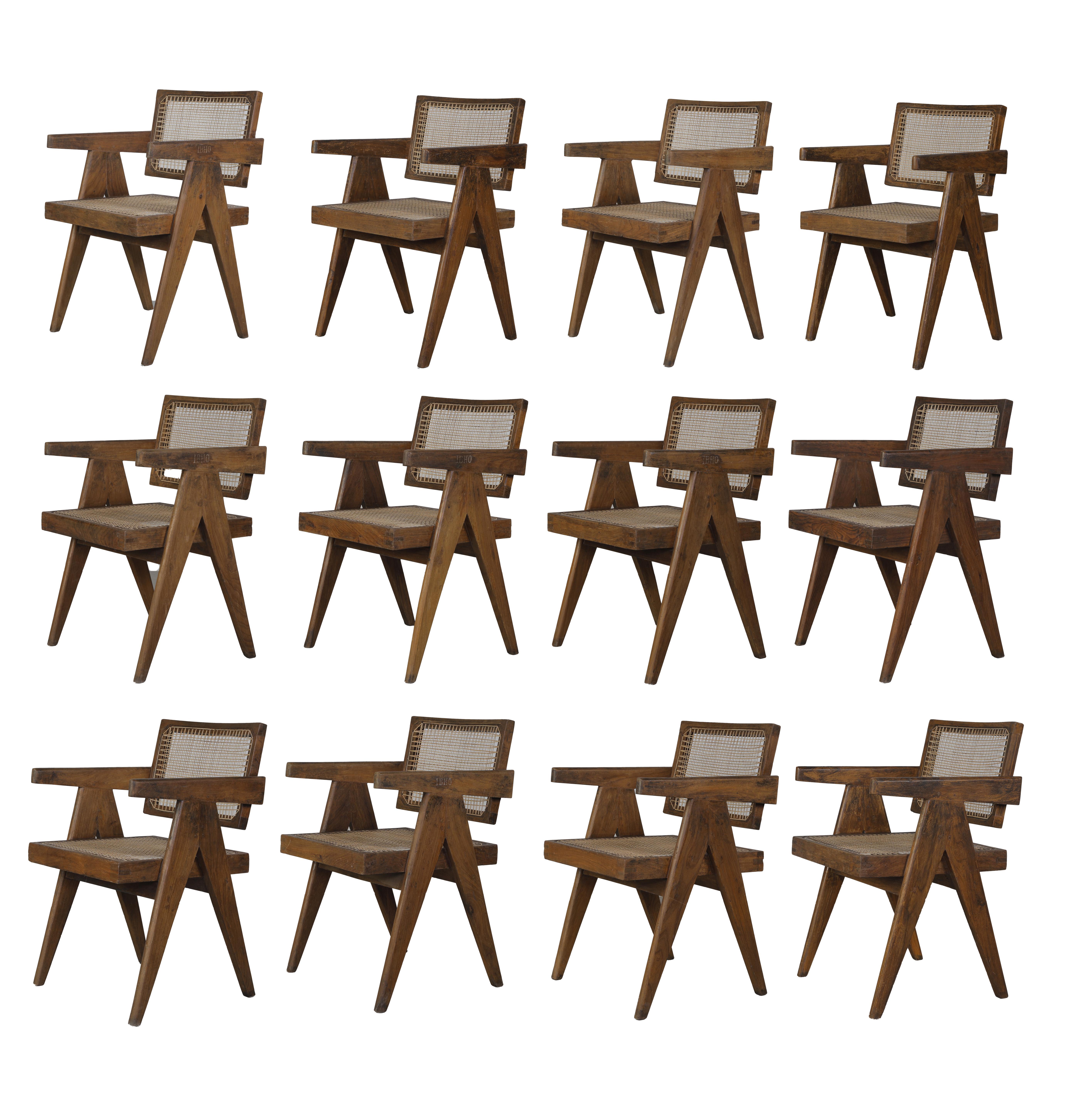 We offer a set of 12 authentic Pierre Jeanneret dining chairs (we offer 6, 10 or 12 too). Normally they are always a bit different in size, so they normally never fit. That is a rare set where dimensions are very similar. So that is a rare