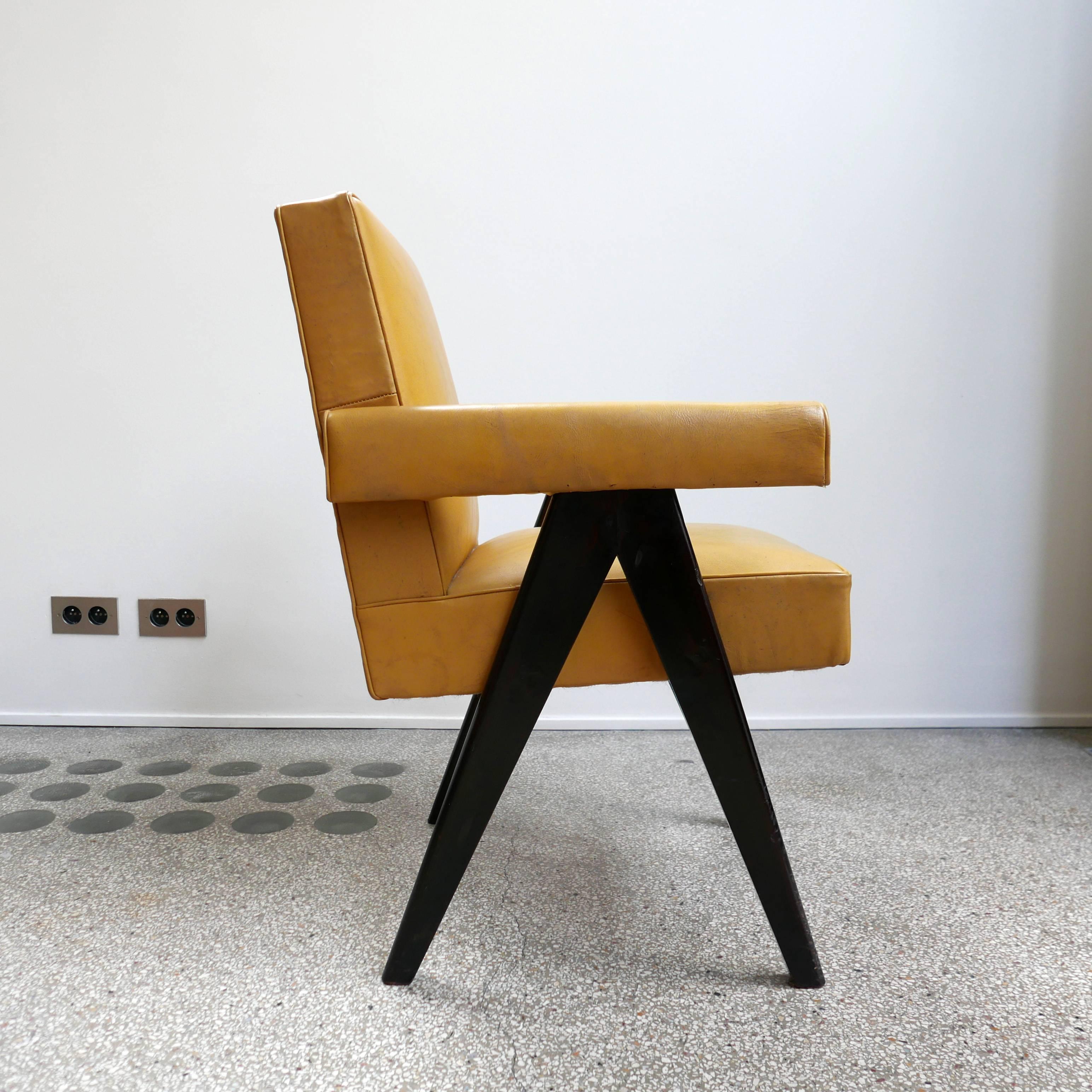 Pierre Jeanneret
PJ-SI-30-A 
Important : vintage collector's item for sale with guaranteed authenticity. 
Armchair called “Committe armchair”, circa 1953-1954
Solid teak wood, Yellow leather.

Bibliography:
Eric Touchaleaume & Gérald Moreau, “Le