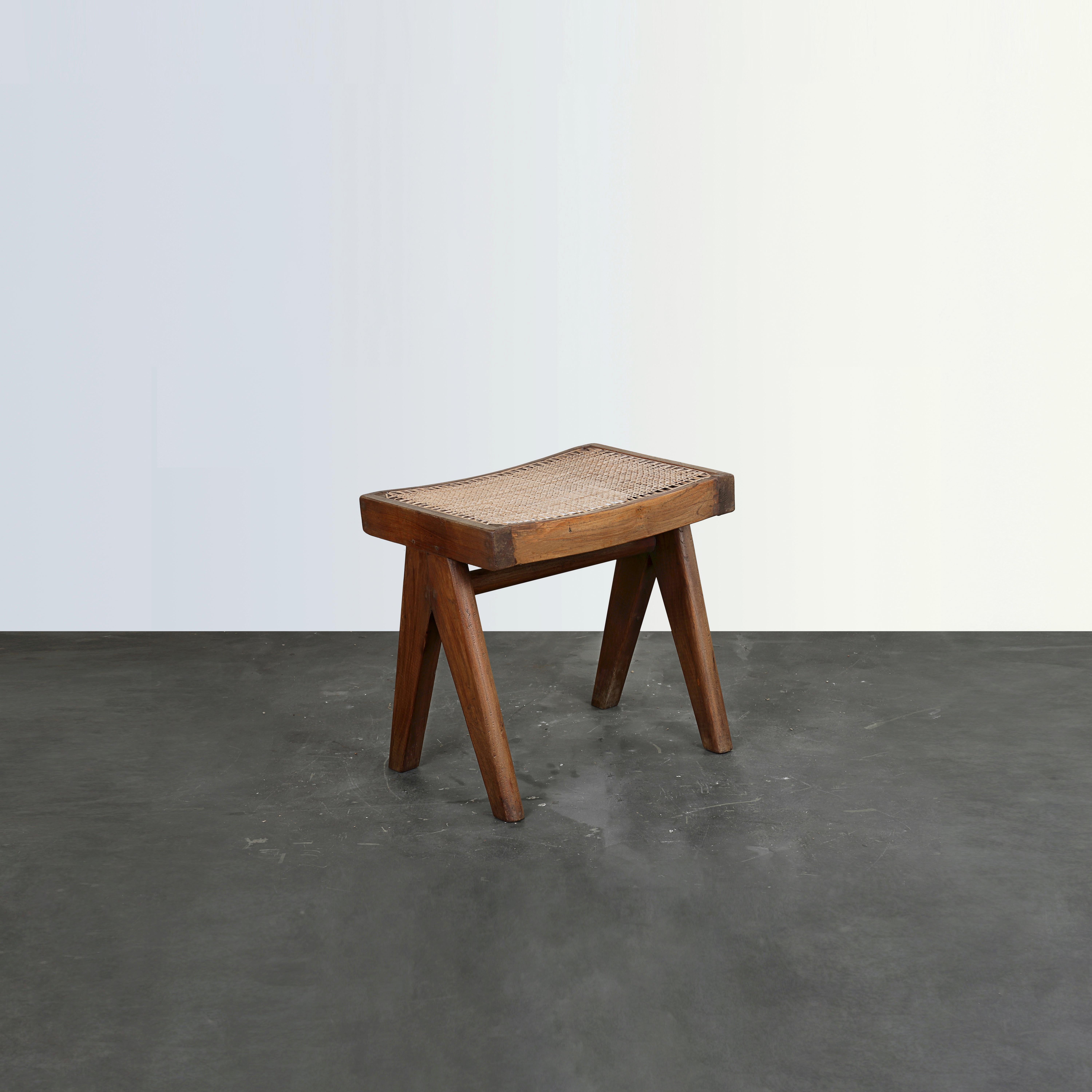 This stool is a fantastic piece; finally it's iconic. It appears so simple and yet so precise, where proportions seem to be perfect. Its patinated teak gives that objects a strong character, showing all that traces of age and its uniqueness. It has