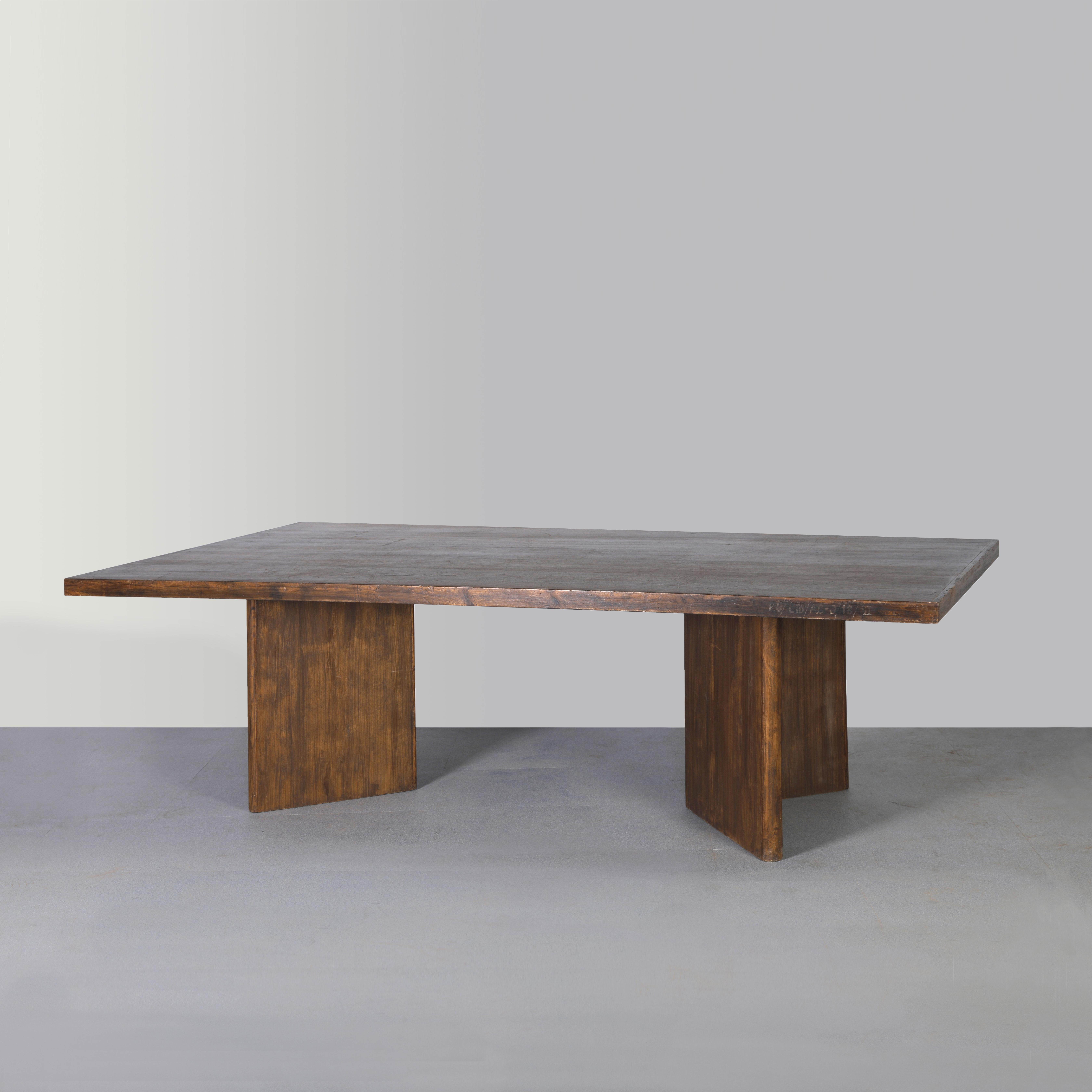 The rare conference table by Pierre Jeanneret has a removable tabletop and is mounted on two 