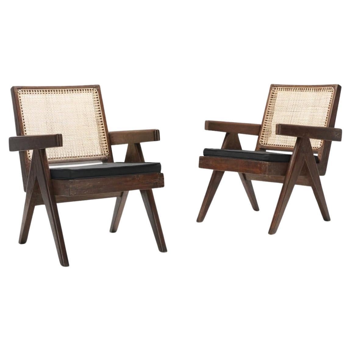 A beautiful set of 2 Pierre Jeanneret easy armchairs in solid teak from Punjab University, Chandigarh.
Stenciled markings to reverse of each example. Set includes black cushions.
The simplicity of the design, yet robust and functional has inspired