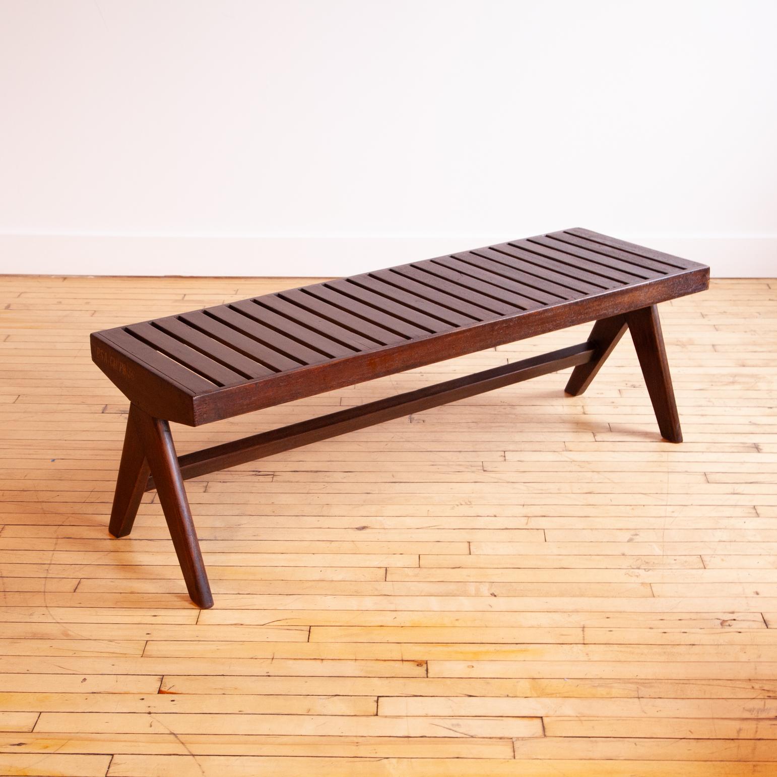 Wonderful example of the desirable slatted bench by Pierre Jeanneret. This is a quality piece for a serious collector. 

Stenciled letters indicate this was Public Bench #36 from the Punjab Secretariat Administration building.

This same model sold