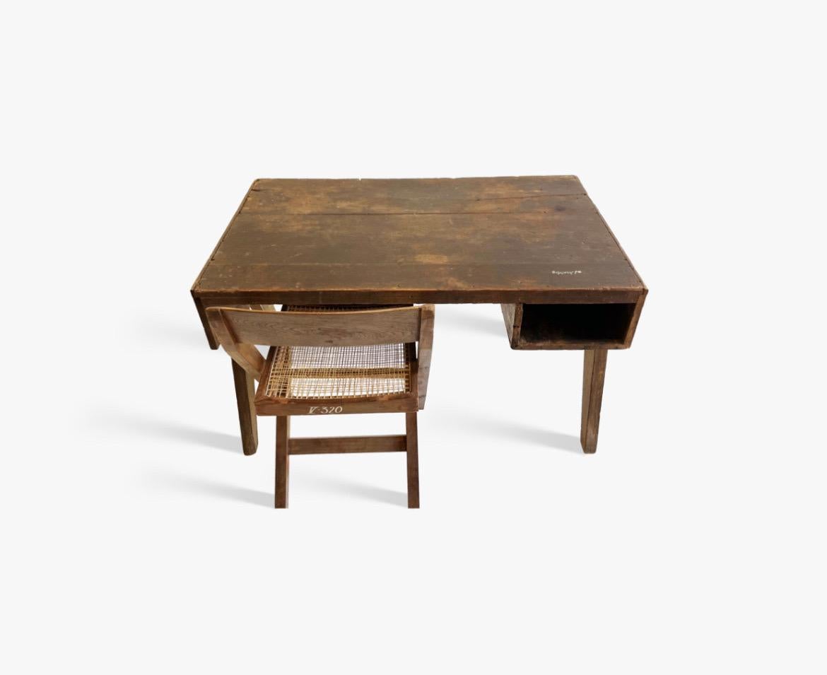 Excellent example of a student desk and library chair from Chandigarh India circa late 1950s. 

Exceptional patina on the wood including various name inscriptions from young students. Just a remarkable piece of history. 

Desk shows signs of age
