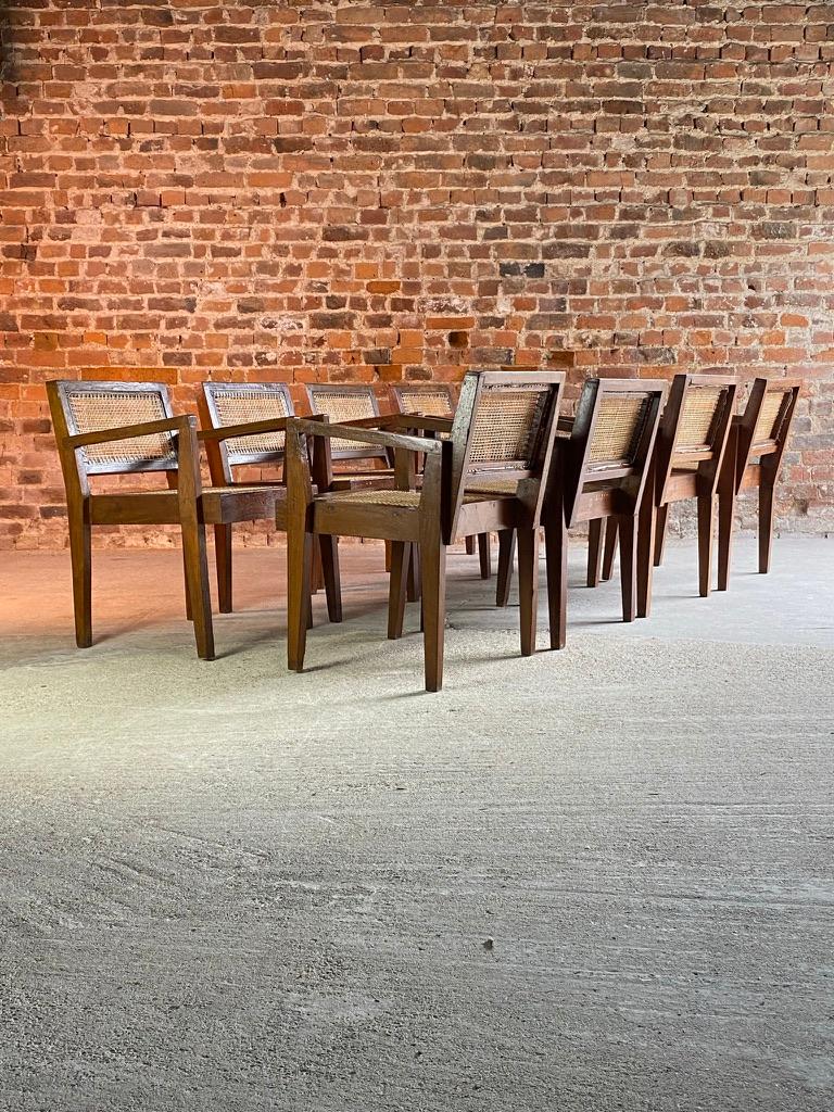Sublime set of eight mid twentieth century Pierre Jeanneret PJ-010502 ‘Take Down’ Armchairs ‘Fauteuil En Teck’ Chandigarh India Circa 1955-60, the solid teak frames with seat and backrest in braided cane work, the leg assembly with angular flat