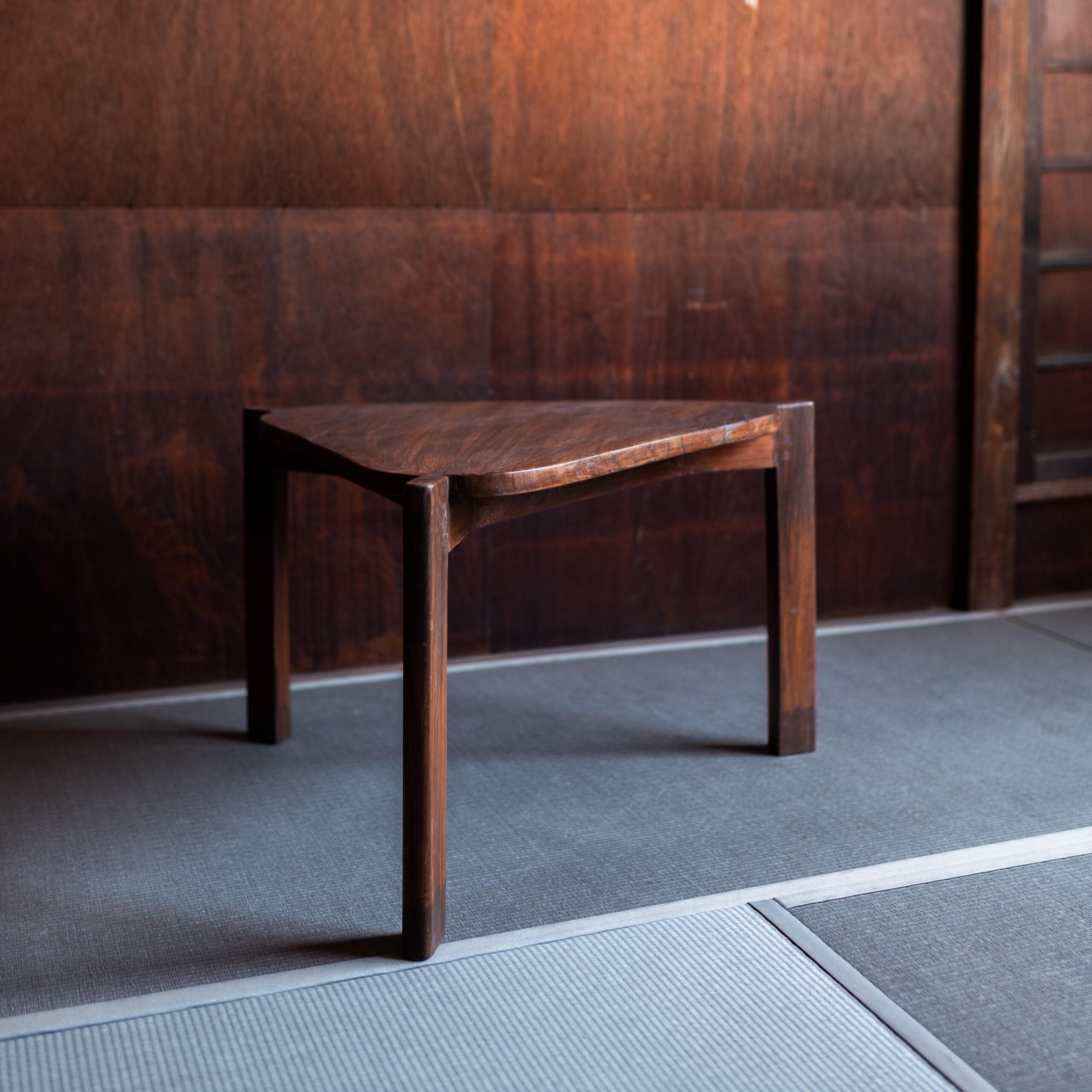 A rare and authentic example from the Chandigarh project in India, this teak triangular lounge table by Pierre Jeanneret reflects the architect’s rational yet sculptural design language. Characterized by its solid teak construction.

The design