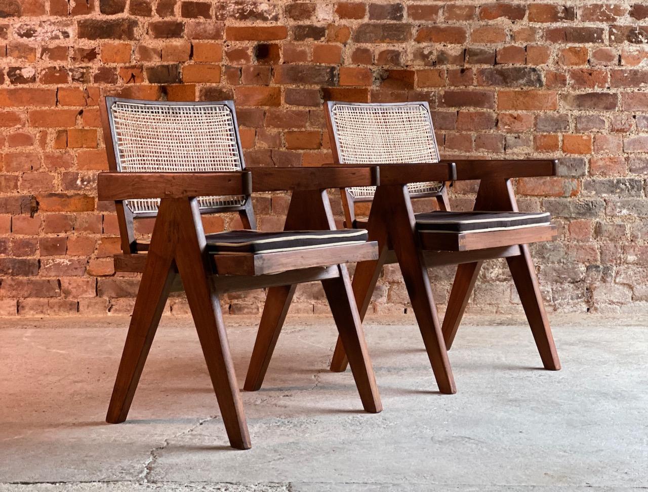 Pierre Jeanneret V leg chairs pair in teak and cane Chandigarh, circa 1955

Magnificent pair of Pierre Jeanneret (1896-1967) fixed back V leg conference chairs from the College of Architecture, Chandigarh India Circa 1955, the chairs featuring an