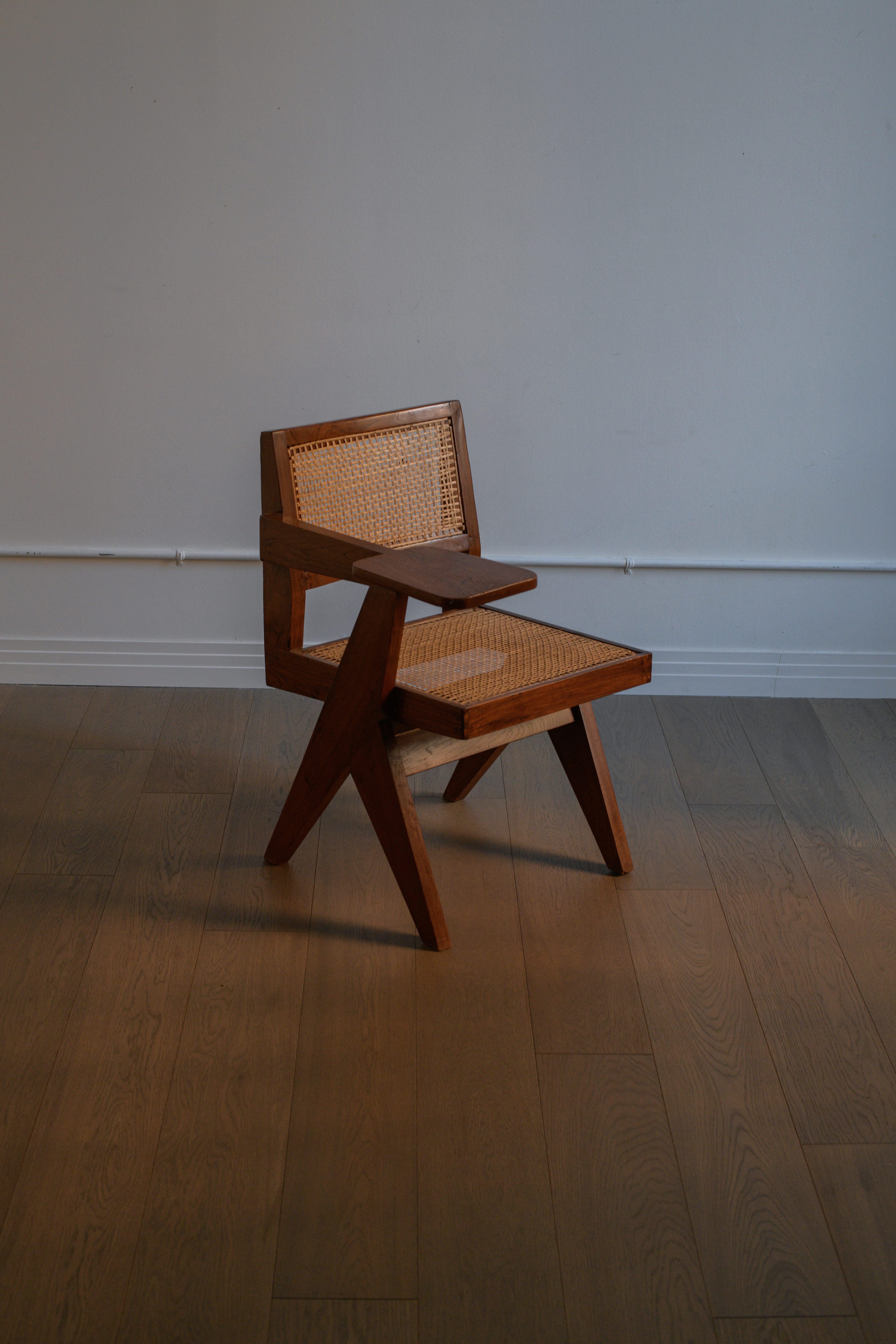 The iconic Pierre Jeanneret Writing Chair from Punjab University, Chandigarh. 

These gorgeous chairs were designed by Pierre Jeannette and mass produced in India for the Utopian city of Chandigarh which was created by his cousin, Le