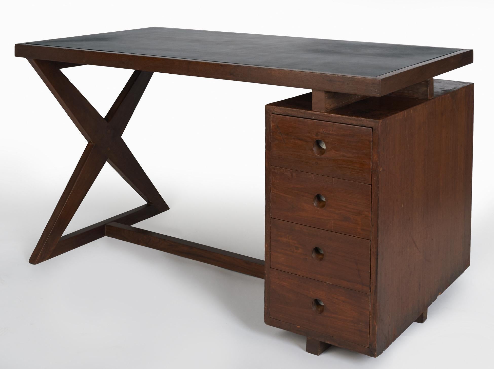 Pierre Jeanneret (1896-1967)

A rare and spectacular four-drawer bureau in teak by Pierre Jeanneret for the civic buildings in Chandigarh, India, designed by Le Corbusier. A stunning and uncommon work, the floating desk features a highly