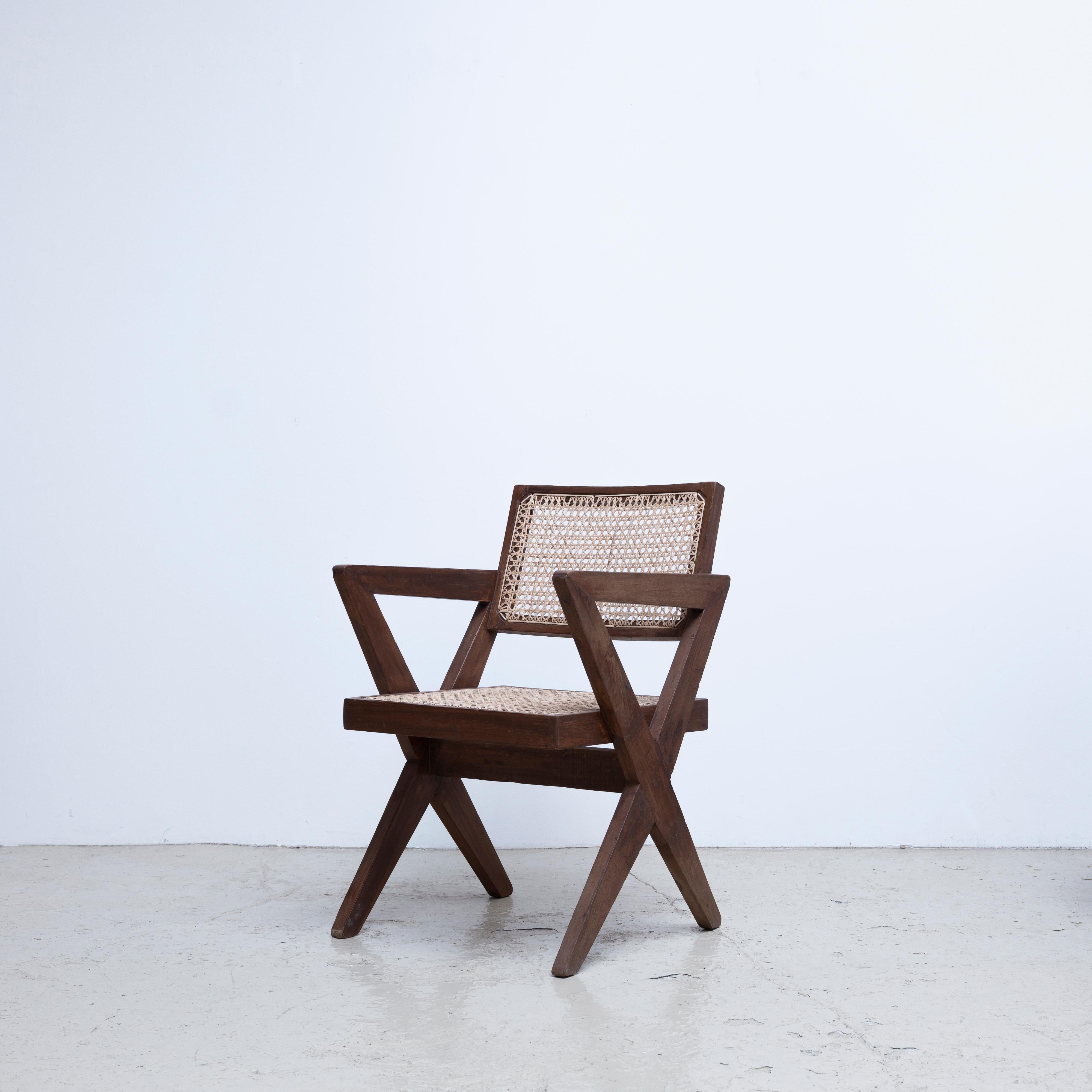 Very rare office chair designed by Pierre Jeanneret for the buildings in Chandigarh in 1960s.
Solid teak wood and cane.
Provenance: D.A.V. College, Chandigarh, India