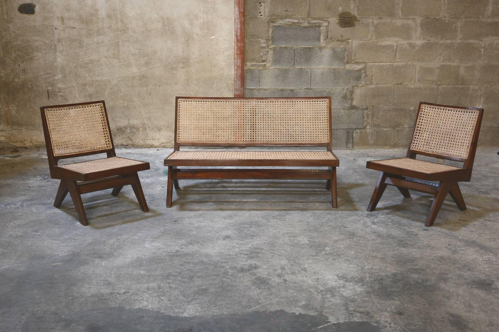 Pierre Jeanneret, very rare sofa set from Punjab University in Chandigarh, India. Solid teak, woven cane. See photos before restoration when I bought these pieces in Chandigarh (we are one of the few to propose these photos).
This set consists of