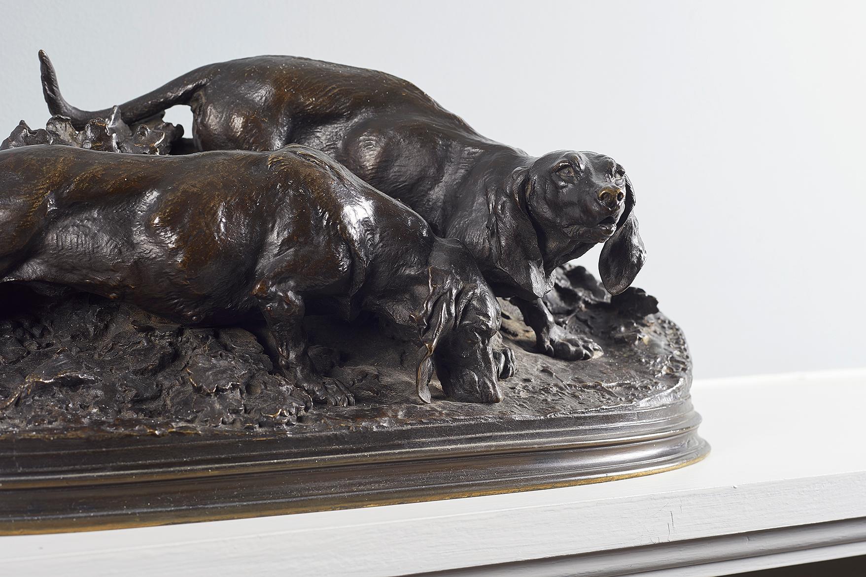 Pierre-Jules Mene (French, 1810-1879), a bronze figural group depicting two hunting dogs, likely long haired daschunds, dark brown patina, signed and dated 'P.J MENE 1857'.
 