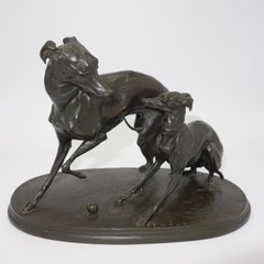 A bronze group of two whippet dogs at play 