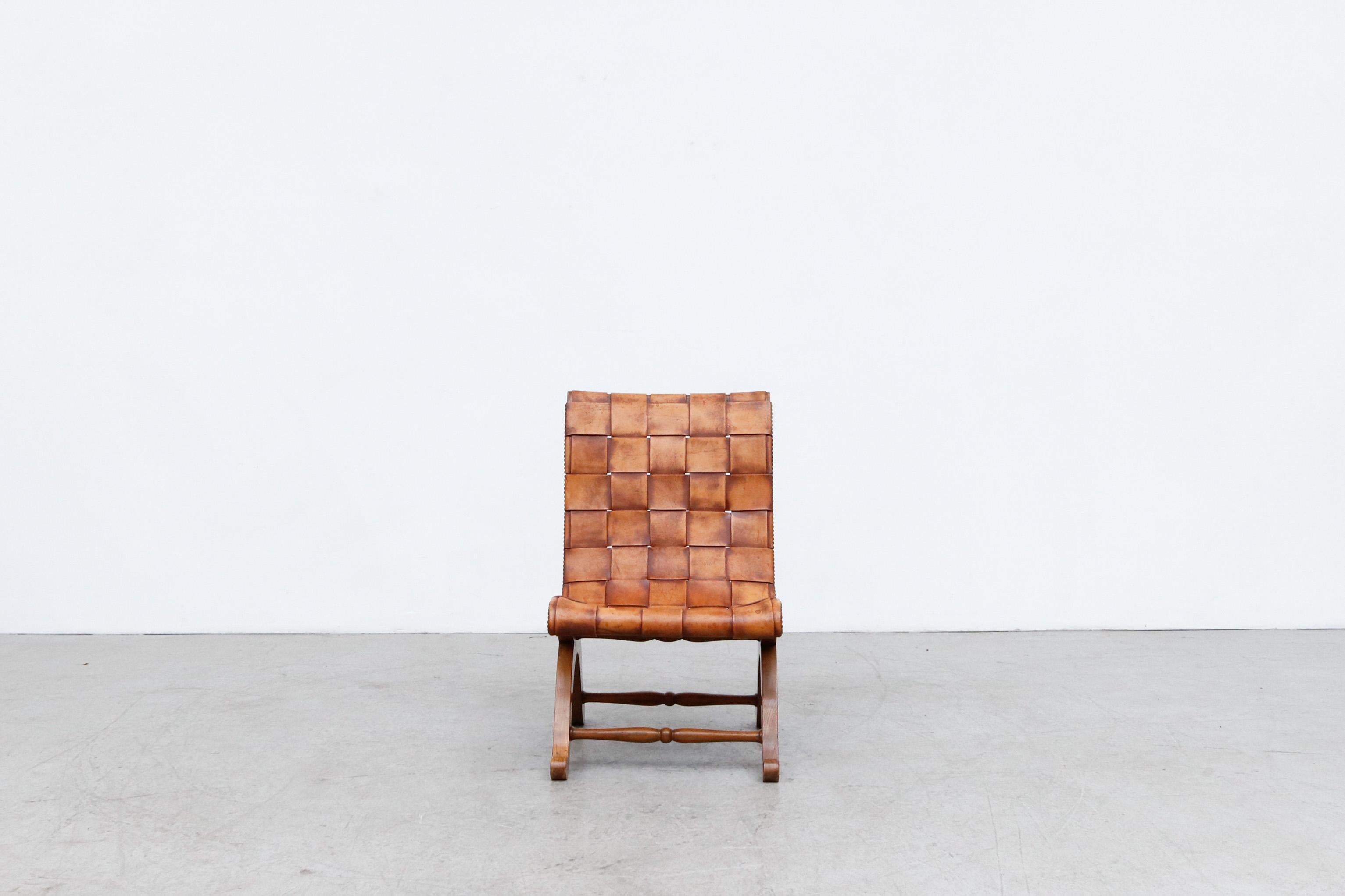 1950's Spanish woven leather side chair by Pierre Lottier. In good original condition with visible patina and wear consistent with age and use.