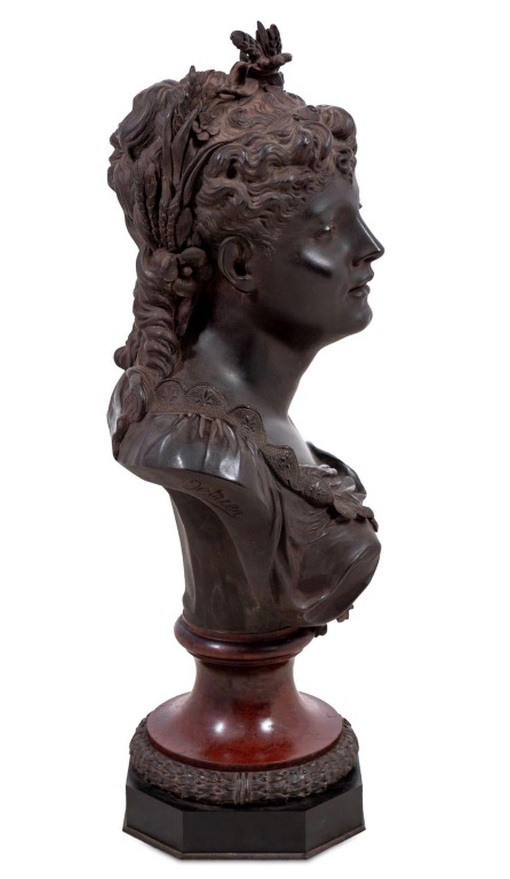 Pierre Louis Detrier (French, 1822-1897) Bronze Bust of a Woman, late 19th century, the beauty wearing a floral crown and flowing dress, signed, on a Rouge Griotte marble socle with laurel border, on an octagonal black marble plinth. 25