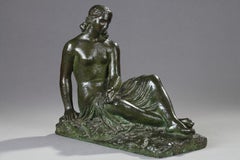 Young woman seated with drapery