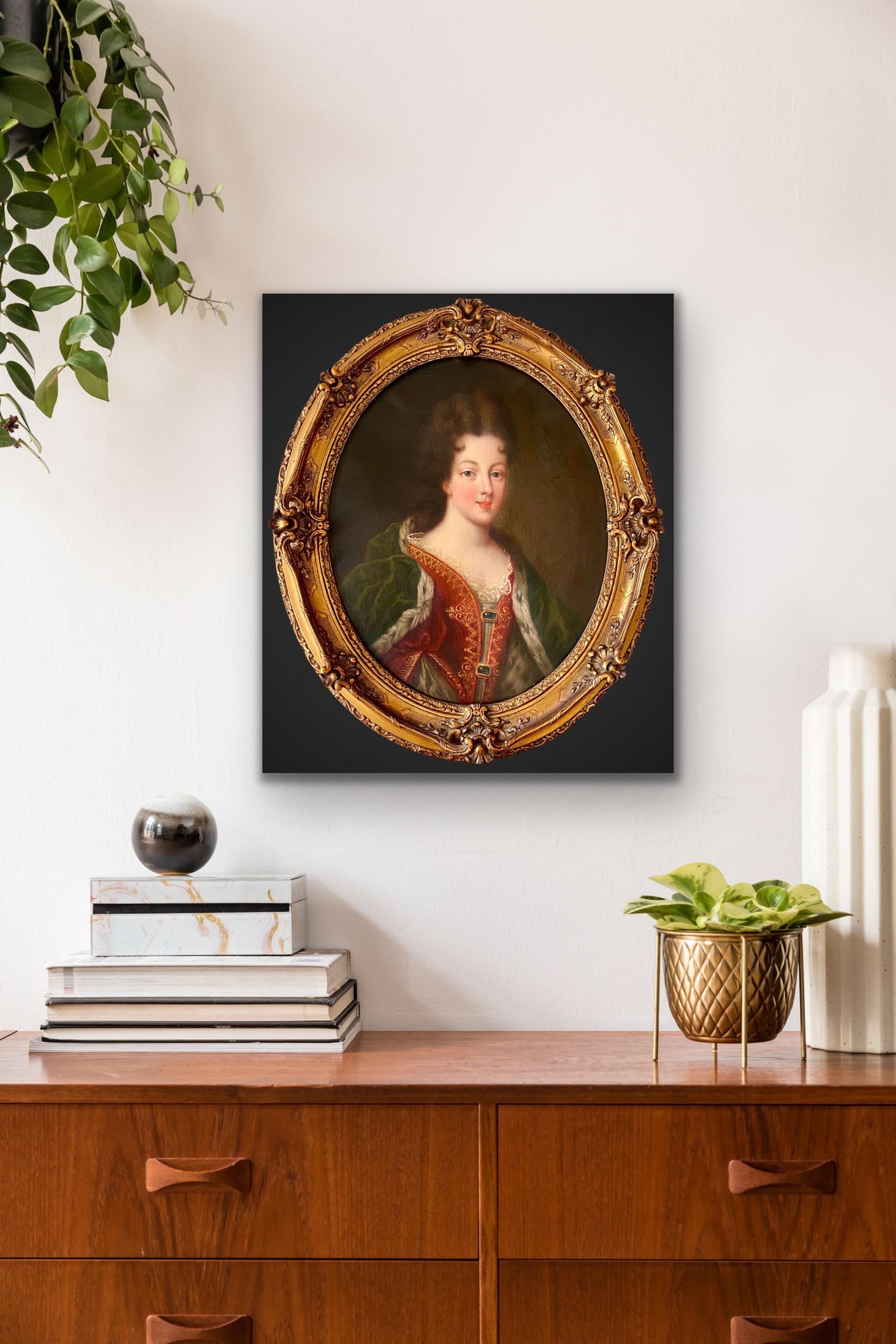 Antique French portrait depicting a young noble lady, possibly a princess.

This sensitively rendered portrait shows a luxuriously dressed beauty, who's wearing an elaborate deep red silk dress with golden embroideries and an elegant lace ruffled