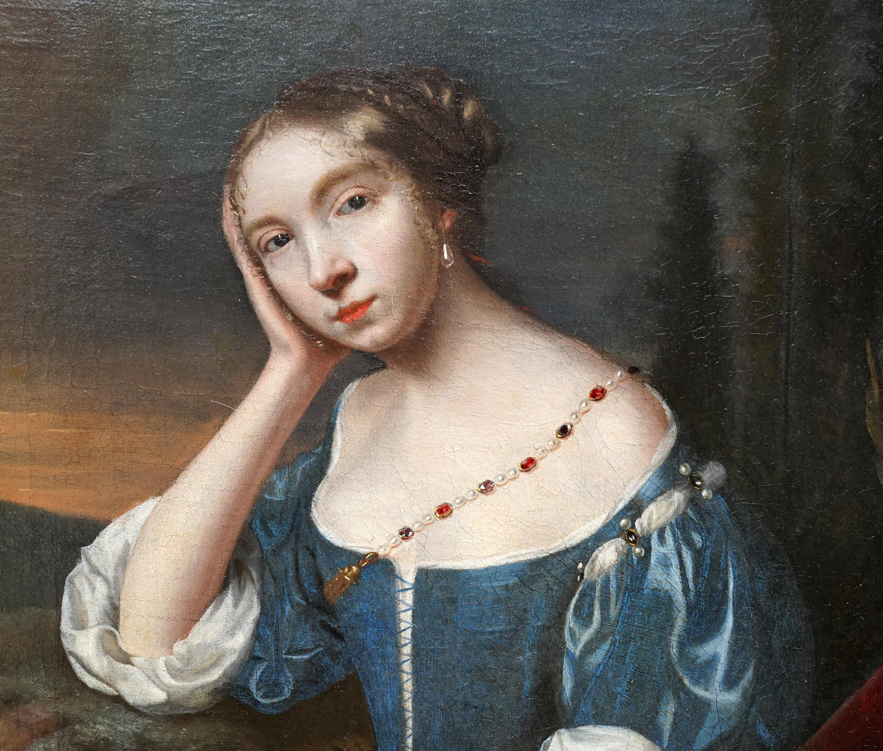Ce superbe portrait à l'huile est attribué à Pierre Mignard. Peint vers 1670, il s'agit d'un portrait assis en pied d'une jeune femme dans un paysage, sous les traits de Diane, avec son carquois de flèches à côté d'elle. Un petit chien saute à ses