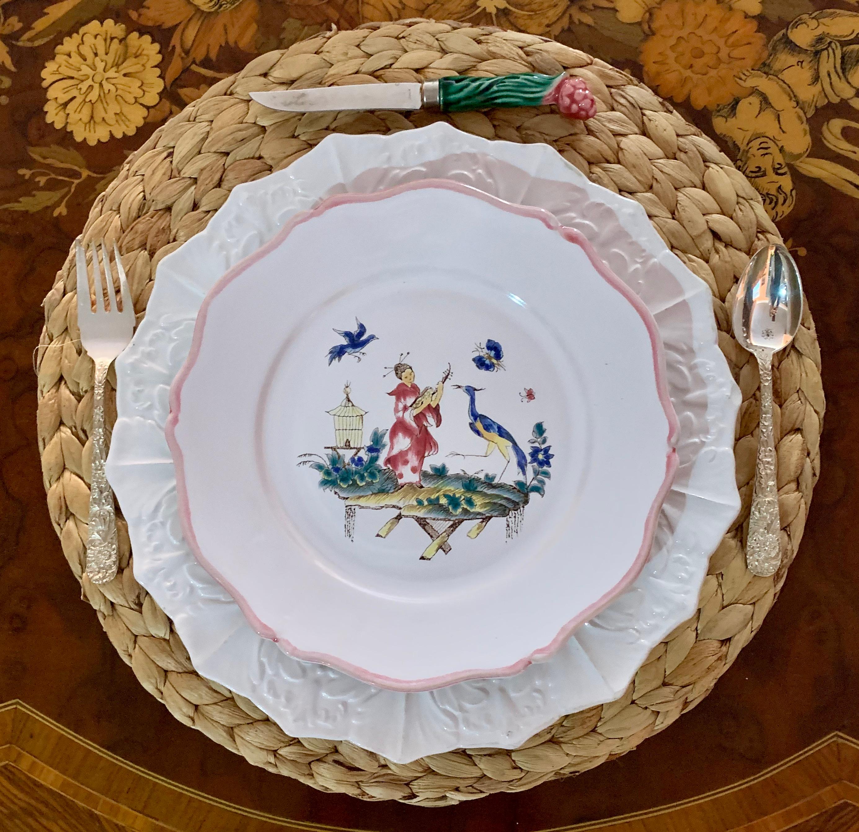 A set of twelve faïence plates in the chinoiserie style, circa early 1960s, by Pierre Motton in Gien, France.

A fine quality faience pottery, hand painted with five different scenes in a chinoiserie design produced for the retailer Tiffany & Co.