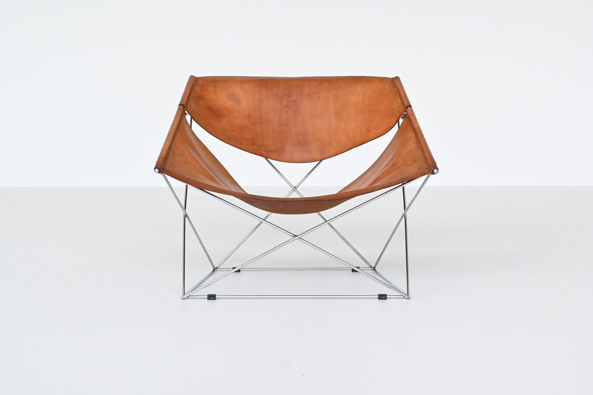 Stunning “Butterfly” lounge chair model F675 designed by Pierre Paulin and manufactured by Artifort, The Netherlands 1963. This chair has a nickel-plated geometric frame that is visually striking. The minimalistic frame against the rich and thick