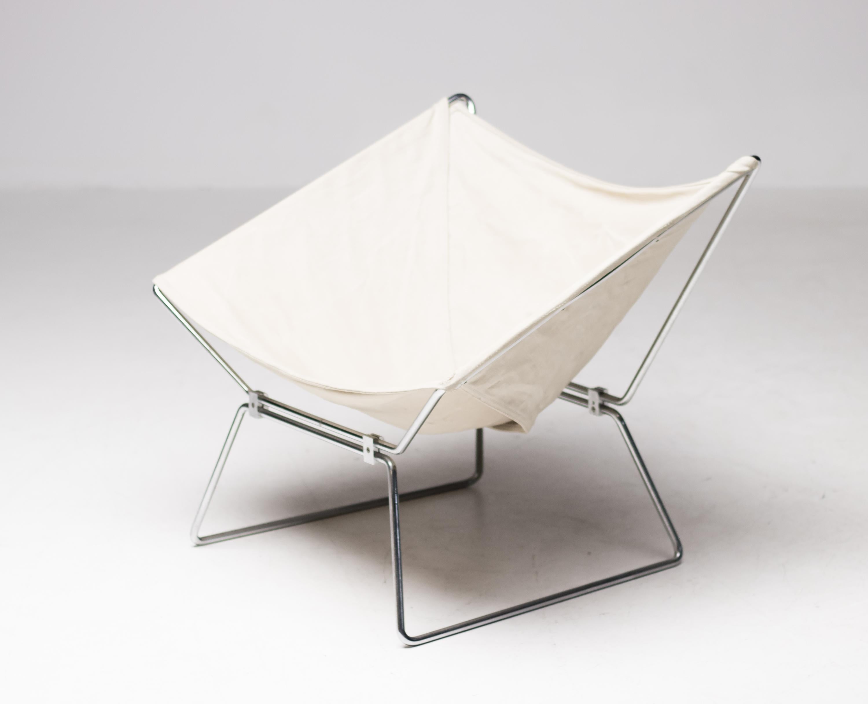 Easy chair model AP14, in canvas and chrome-plated steel, designed by Pierre Paulin for AP Originals, the Netherlands, 1954. Rare chair in original canvas upholstery. AP (A. Polak) was a Dutch furniture manufacturer. The frame consist of two pieces