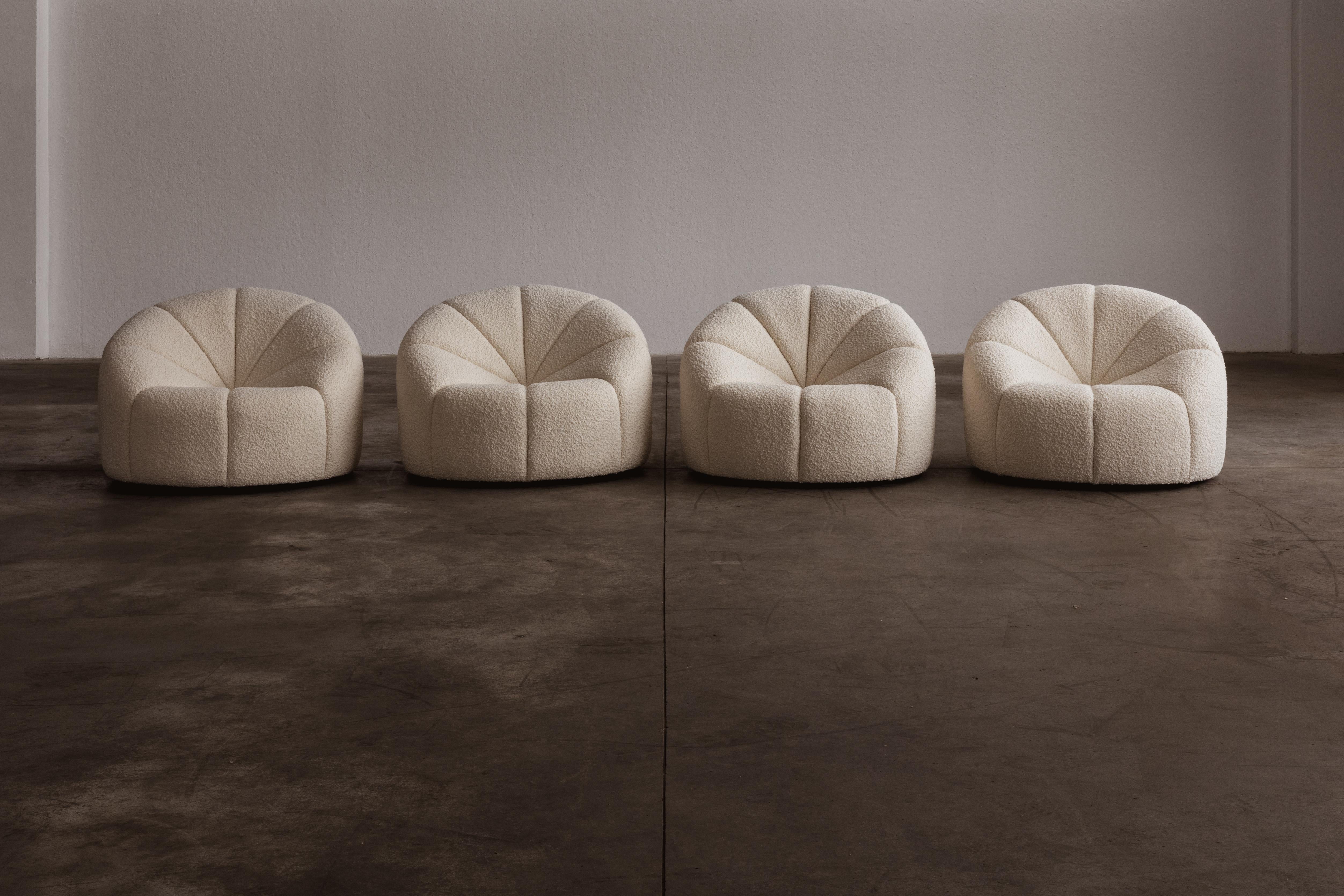 Pierre Paulin “Elysée” armchairs, wool bouclé and foam, France, designed in 1972, set of four.

Commissioned in the 1970s by French President Pompidou to fit out a series of reception rooms in the Elysée Palace, Paulin brought modernity to the
