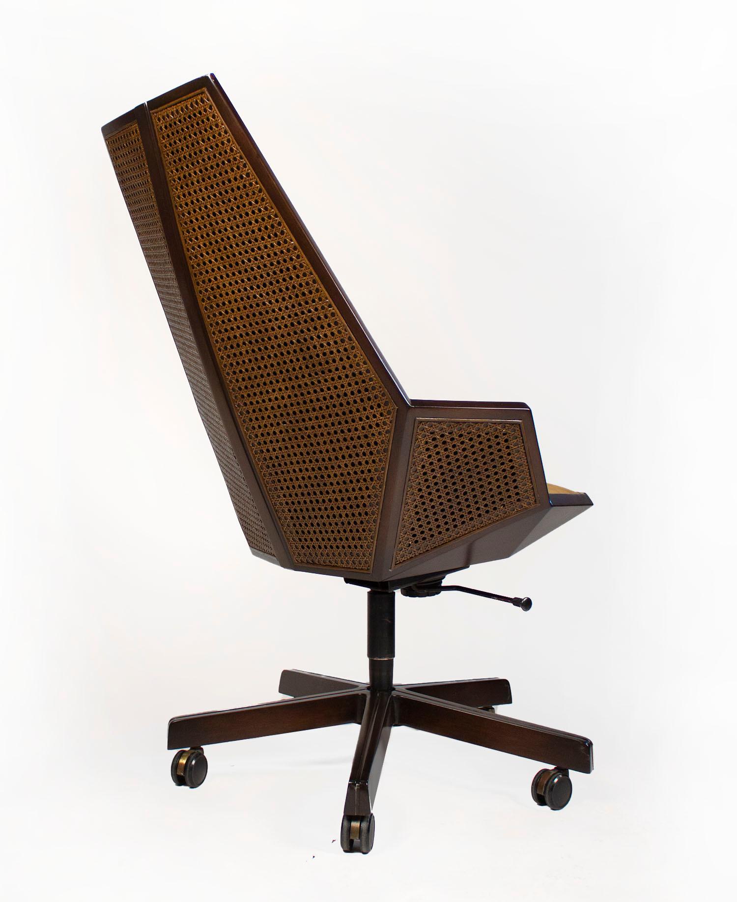 Extremely rare executive desk chair model #1031 designed by Pierre Paulin for Baker Furniture in Solid Mahogany, cane, and suede. 

The coordinating Hexagonal Shaped Custom Executive desk is available separately for $32,500.00
  

literature: