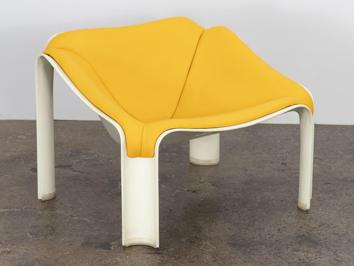 Early production F300 lounge chair, designed by Pierre Paulin for Artifort. A striking space-age form, with appealing curving planes, constructed of molded fiberglass. Luxurious yellow leather upholstery elevates the design yet keeps it fun and