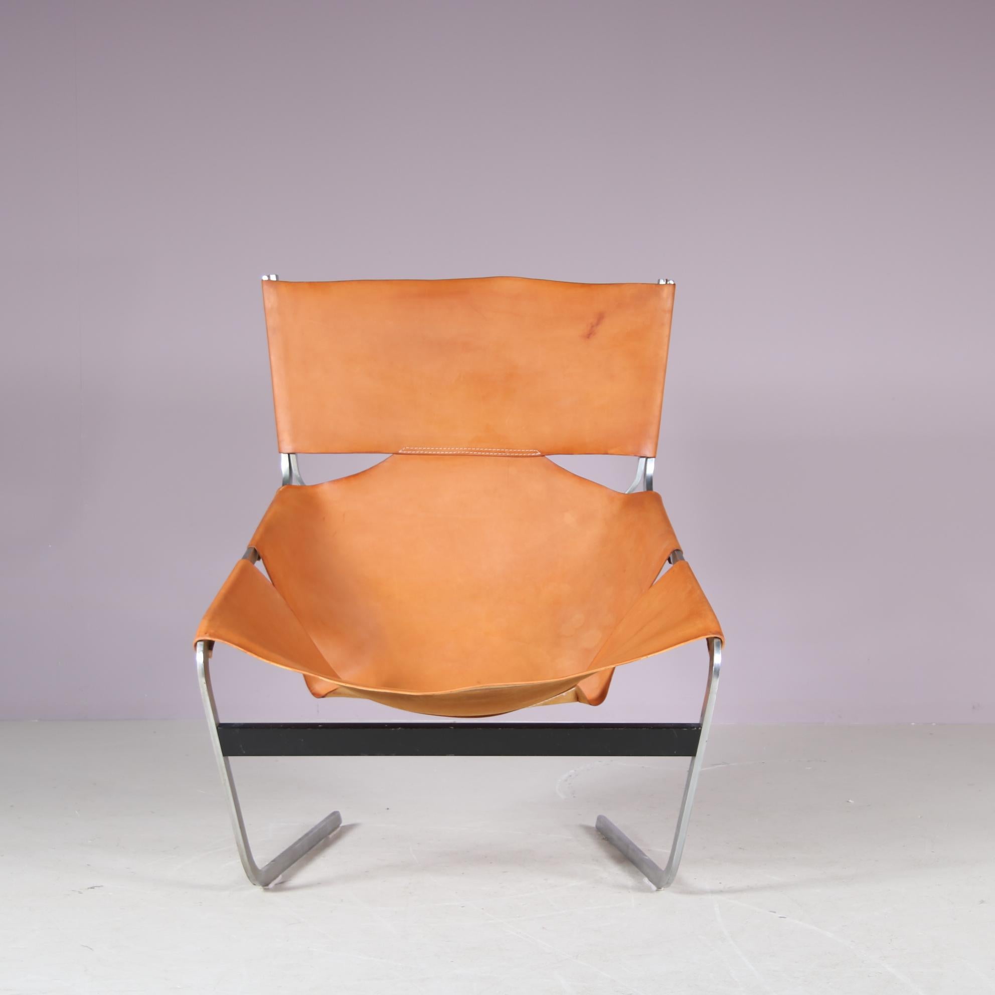 This iconic lounge chair, model “F444”, was designed by Pierre Paulin and manufactured by Artifort in the Netherlands around 1960.

A highly recognizable and much sought after design by Paulin! The structure is made of high quality chrome plated