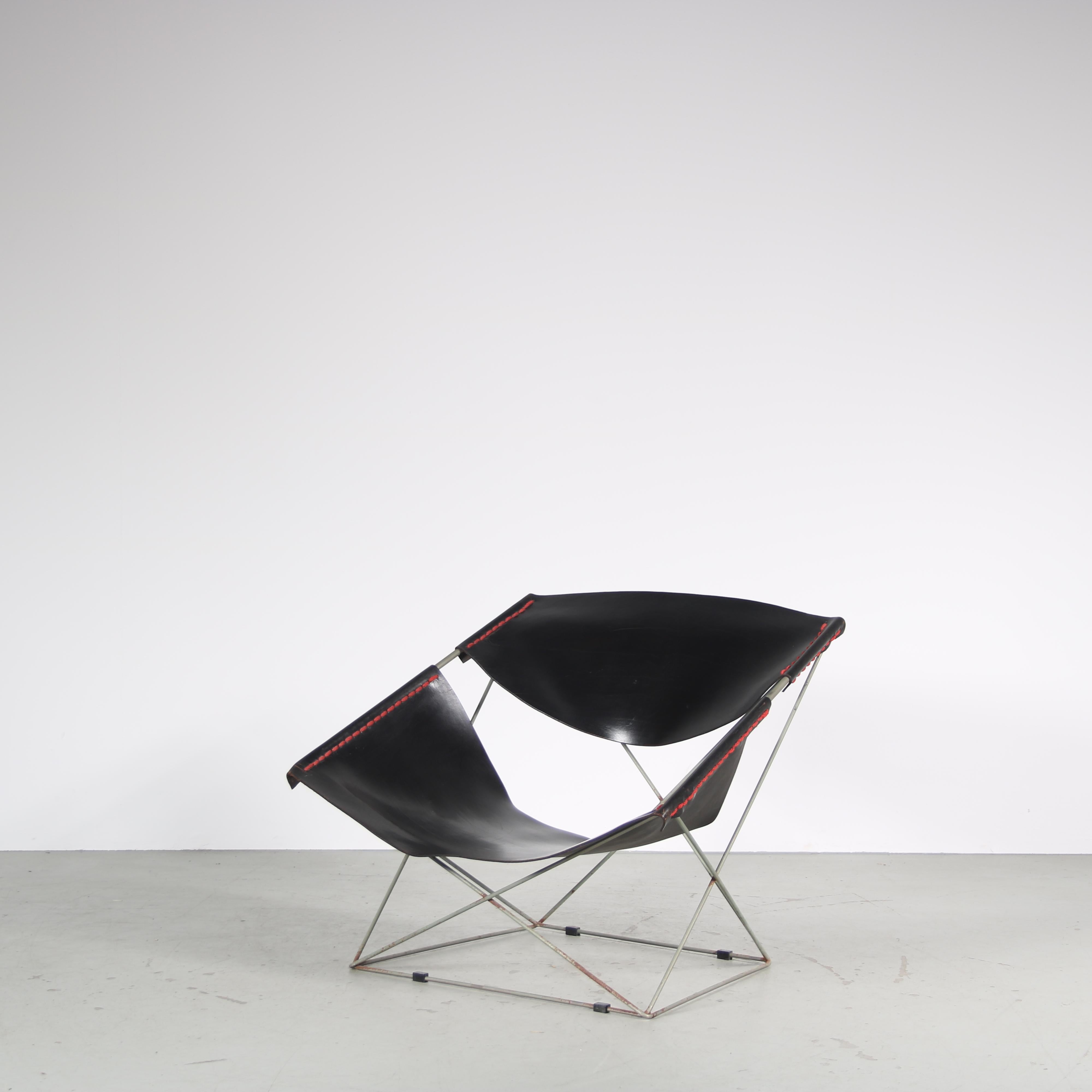 An iconic “Butterfly” lounge chair, model F675, designed by Pierre Paulin and manufactured by Artifort in the Netherlands around 1960.

Made of high quality chrome plated metal holding black saddle leather for the seat and back. This combination