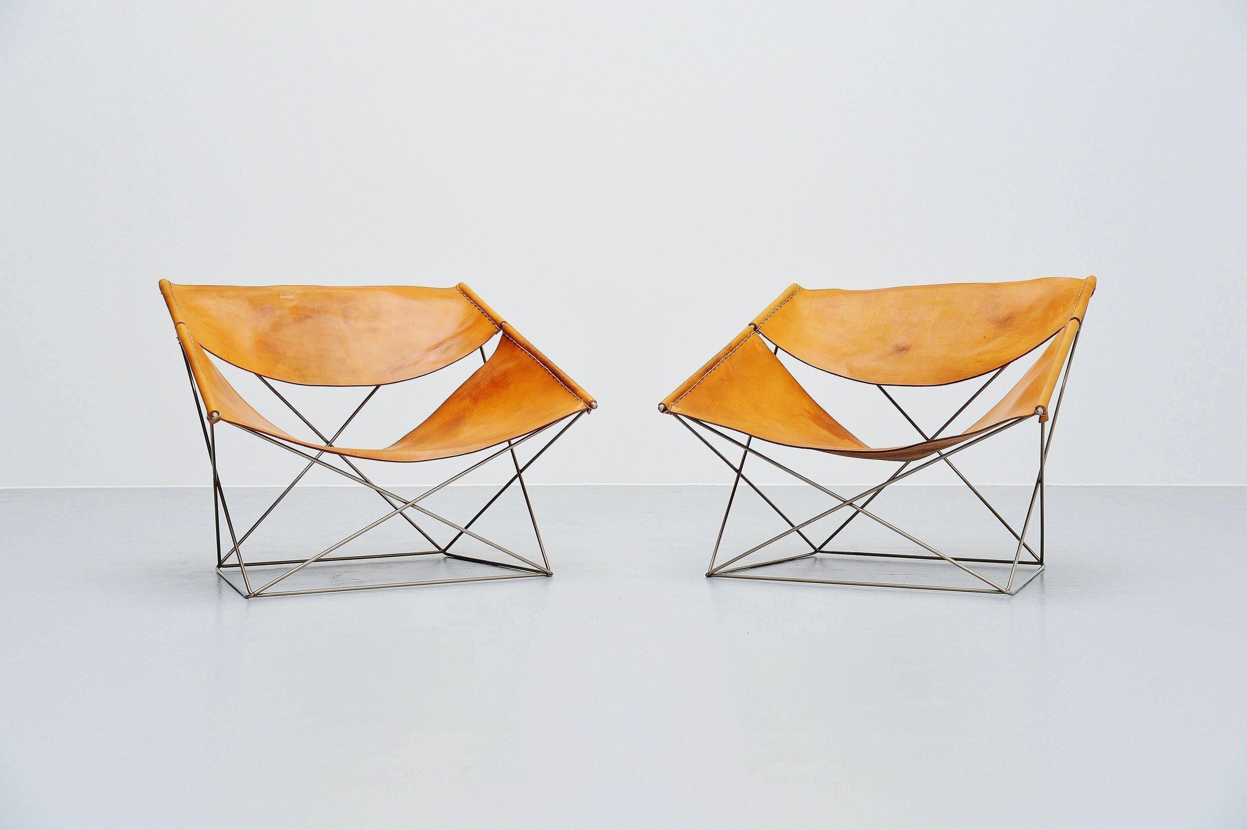 Stunning set of 2 so called 'Butterfly' lounge chairs model F675 designed by Pierre Paulin and manufactured by Artifort, Holland, 1963. These chairs have a nickel plated wire metal frame with nice patina from age, as these are from the first