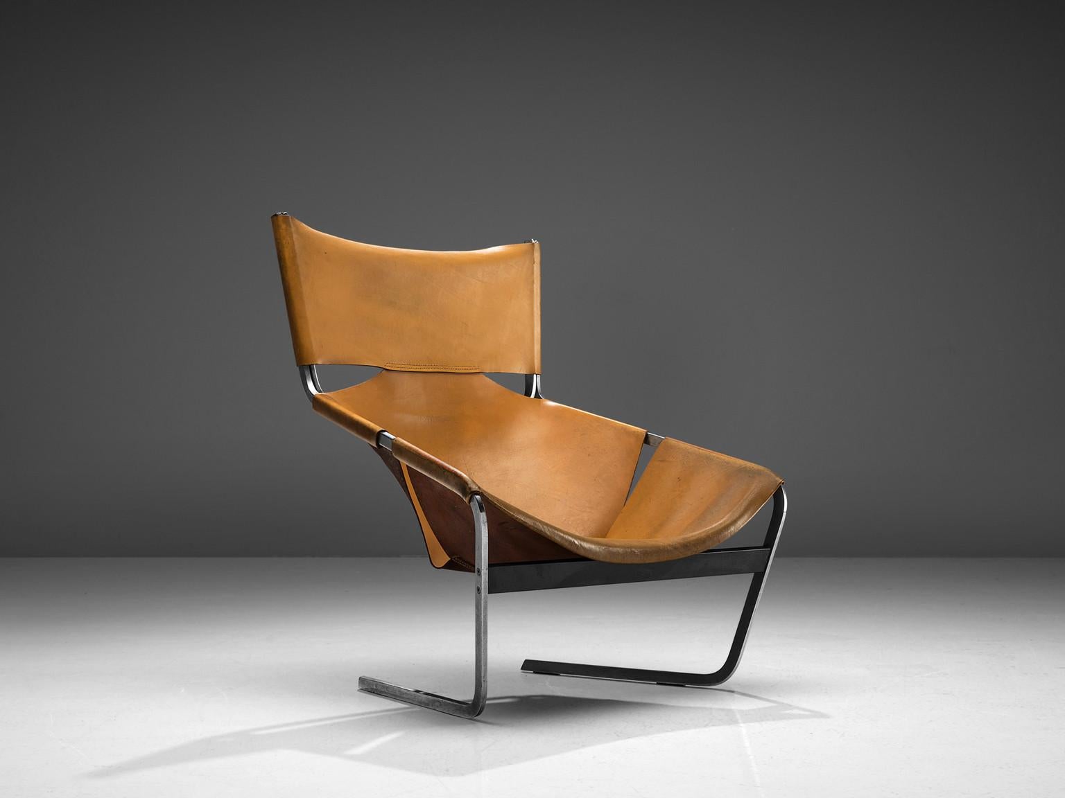 Pierre Paulin for Artifort, F-444 easy chair, metal and cognac leather, the Netherlands, circa 1962.

This cognac leather F-444 chair is designed by Pierre Paulin for Artifort in 1962. This chair shows sharp lines and an angled open seat that