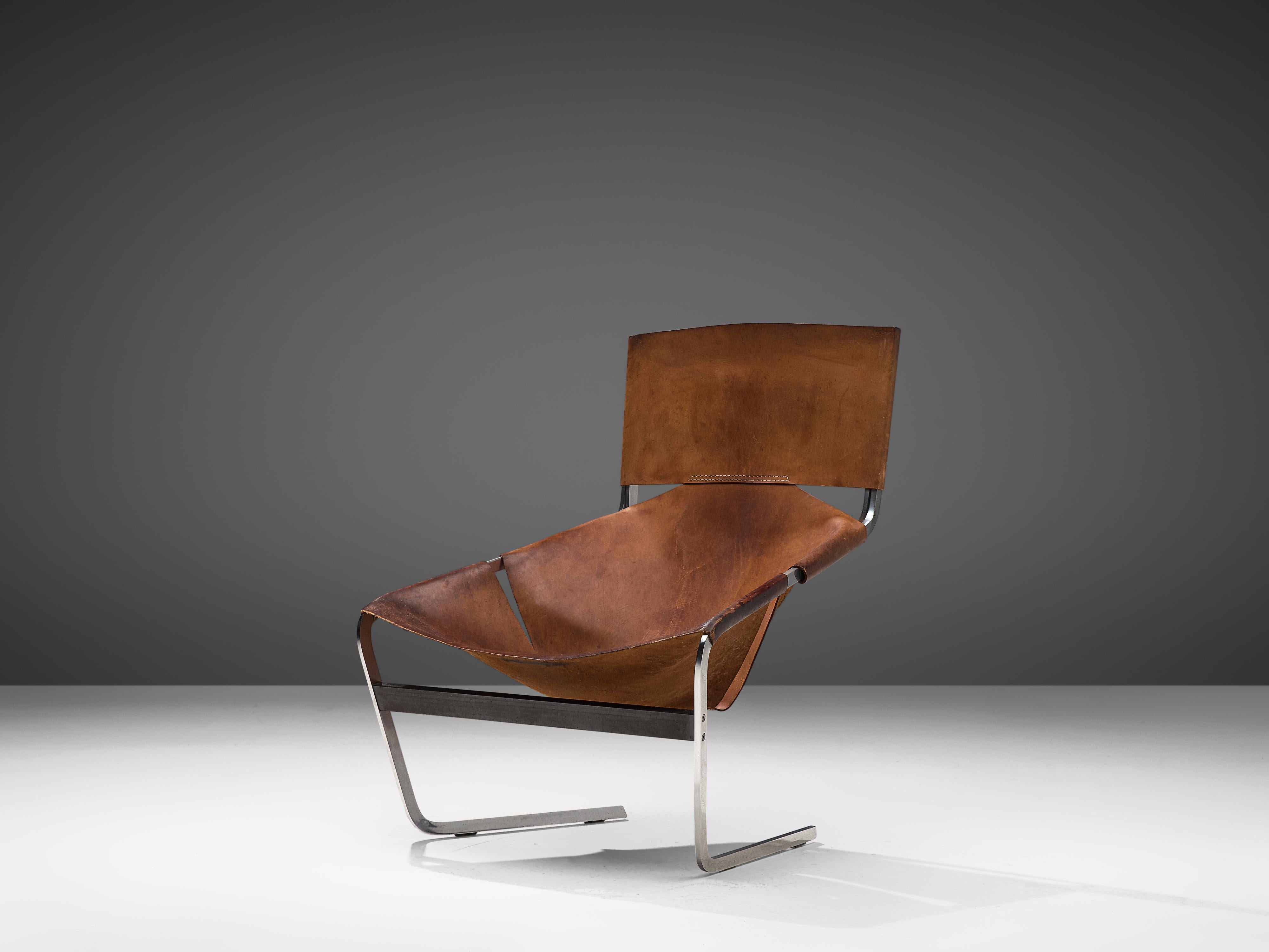 Pierre Paulin for Artifort, easy chair F-444, metal, cognac leather, the Netherlands, circa 1962

F-444 lounge chair designed by Pierre Paulin for Artifort in the 1960s. Eye-catching is the way the patinated leather is adjusted to the flat metal