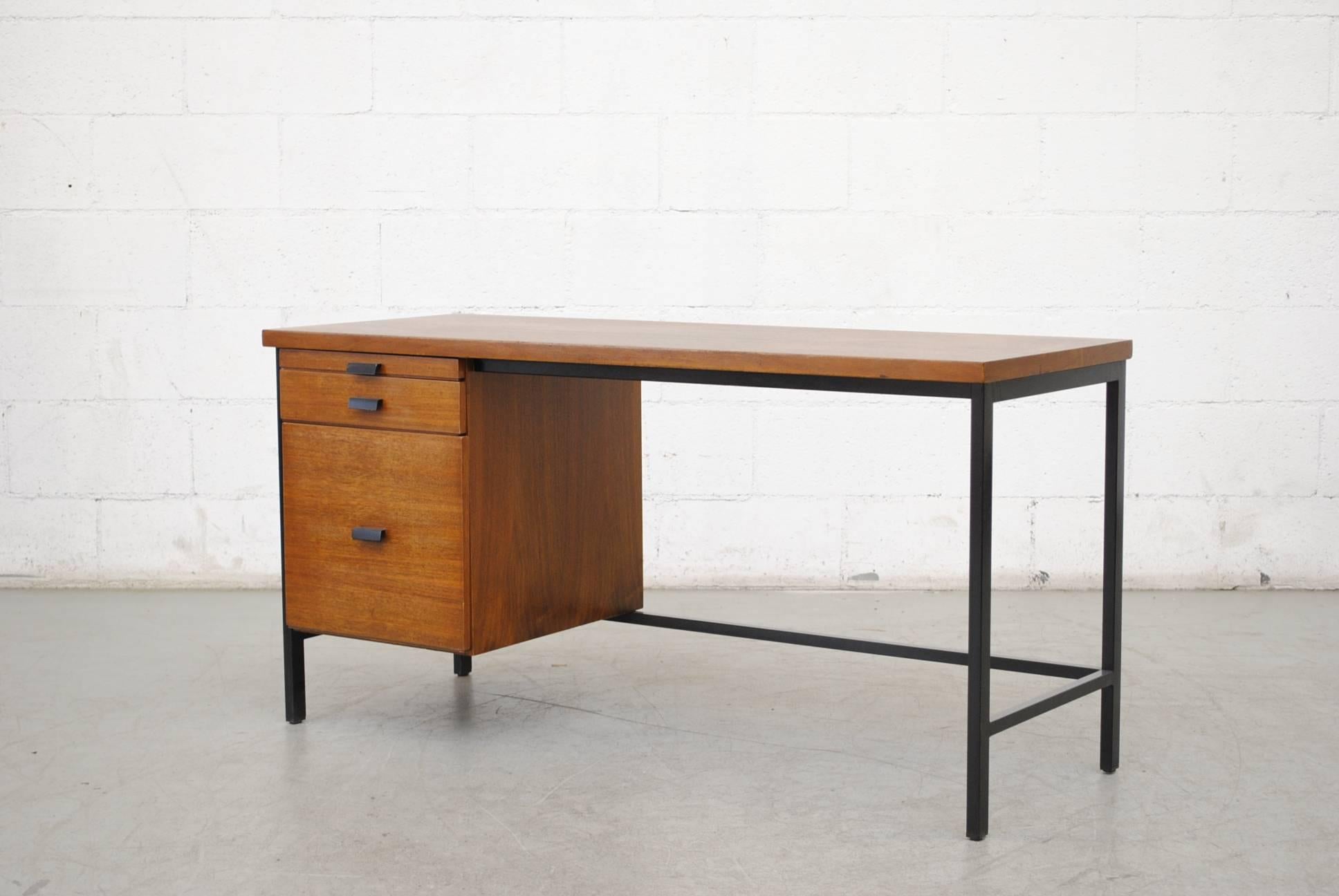 Midcentury Pierre Paulin inspired writing desk. Lightly refinished teak with black enameled metal frames and hand pulls. Super cool pullout filing cabinet drawer, organizer top drawer, and two sliding drawers. Original condition with visible wear.