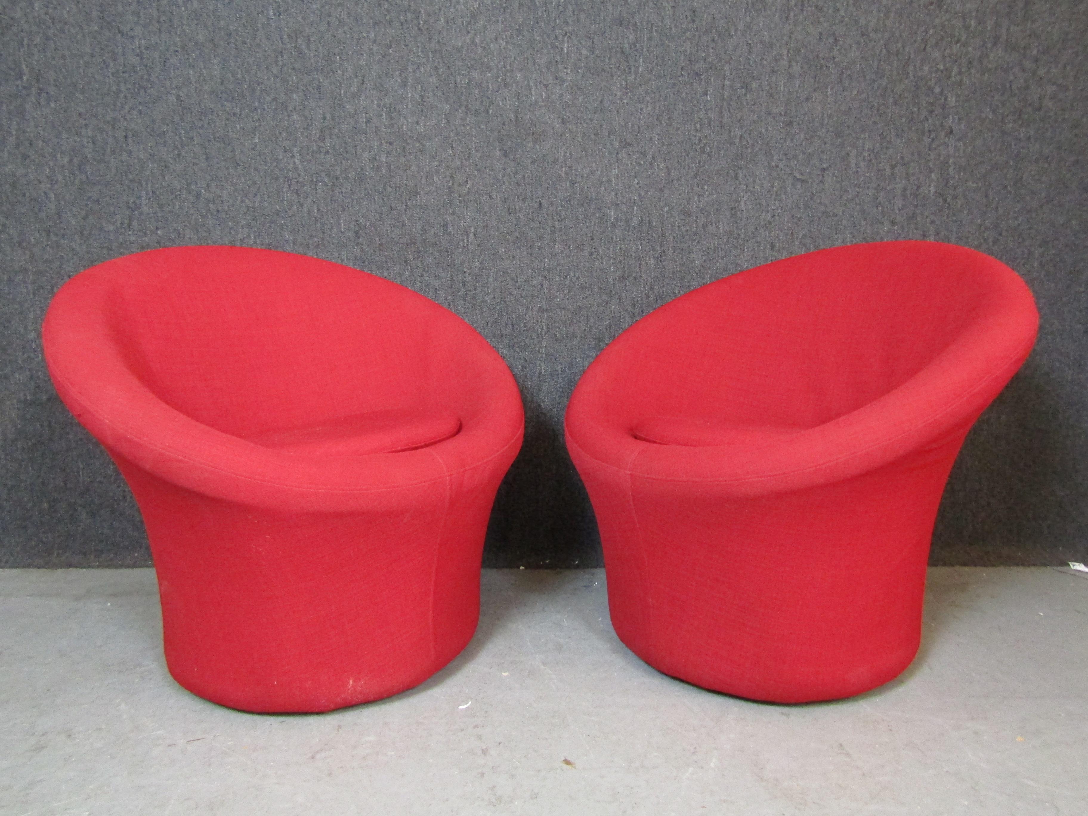 Pair of mid-century modern swivel chairs by Pierre Paulin in bright red fabric. Great soft form with swivel base.
Please confirm location NY or NJ