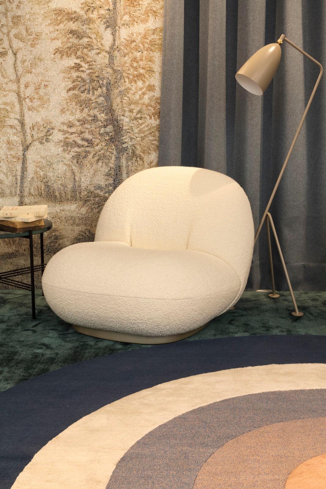 Plush, comfortable, versatile and stylish. This piece is an understated luxury. A welcoming statement lounge chair that can still the scene as easily as it can blend in a variety of style environments. Each piece is made to order. Studio and COM