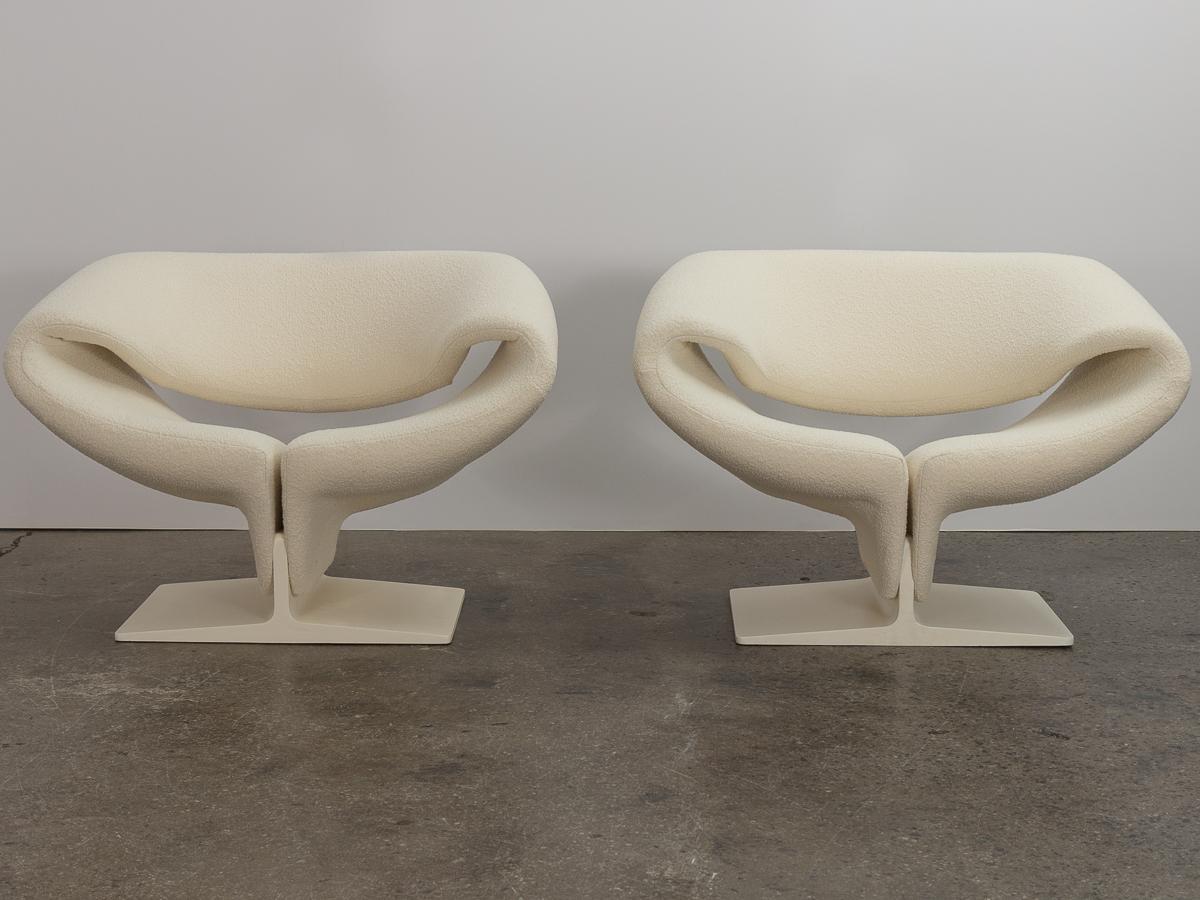 Original, first-issue pair of ribbon chairs model 582, designed by Pierre Paulin for Artifort. A striking, space-age form with curving planes. Plush seat is mindful of the body and supremely comfortable, floating on pedestal base. The sculptural