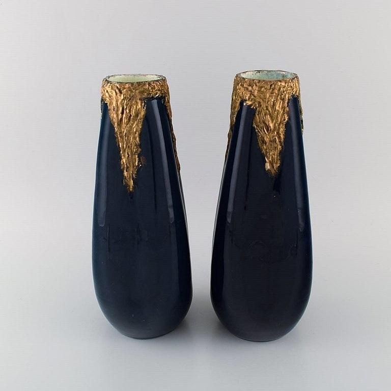 Pierre Perret for Vallauris. 
A pair of antique vases in glazed ceramics. Beautiful glaze in deep blue shades and hand-painted gold decoration. Early 20th century.
Measures: 30 x 13 cm.
In excellent condition.
Stamped.