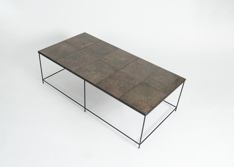 A large, rare rectangular coffee table in glazed lava stone and blackened metal by French designer Pierre Sabatier.