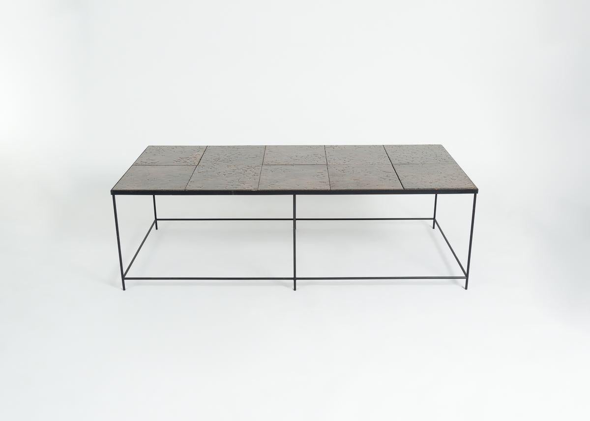 A large, rare rectangular coffee table in glazed lava stone and blackened metal by French designer Pierre Sabatier.