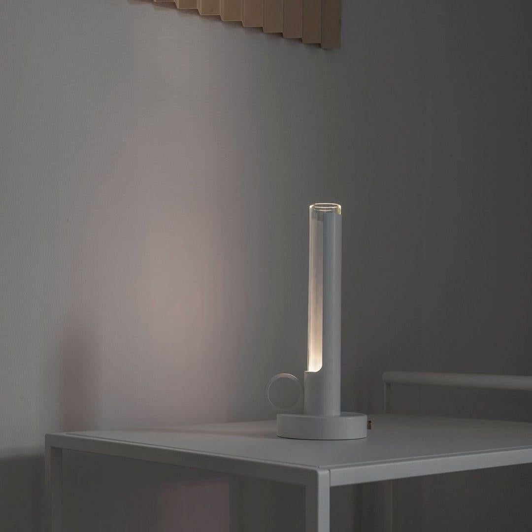 Pierre Sindre white 'Visir' portable metal and glass table lamp for Örsjö

Designed by Scandinavian creator Pierre Sindre, the 'Visir' portable table lamp is an homage to the classic portable oil lamp of the past, but with upgraded features such as