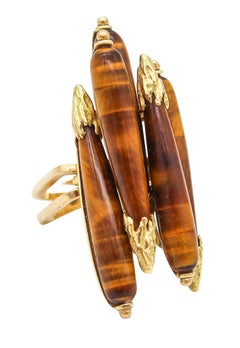 PIERRE STERLÉ 1950 Bague Ultra Moderniste en or jaune 18Kt avec cinq yeux de tigre