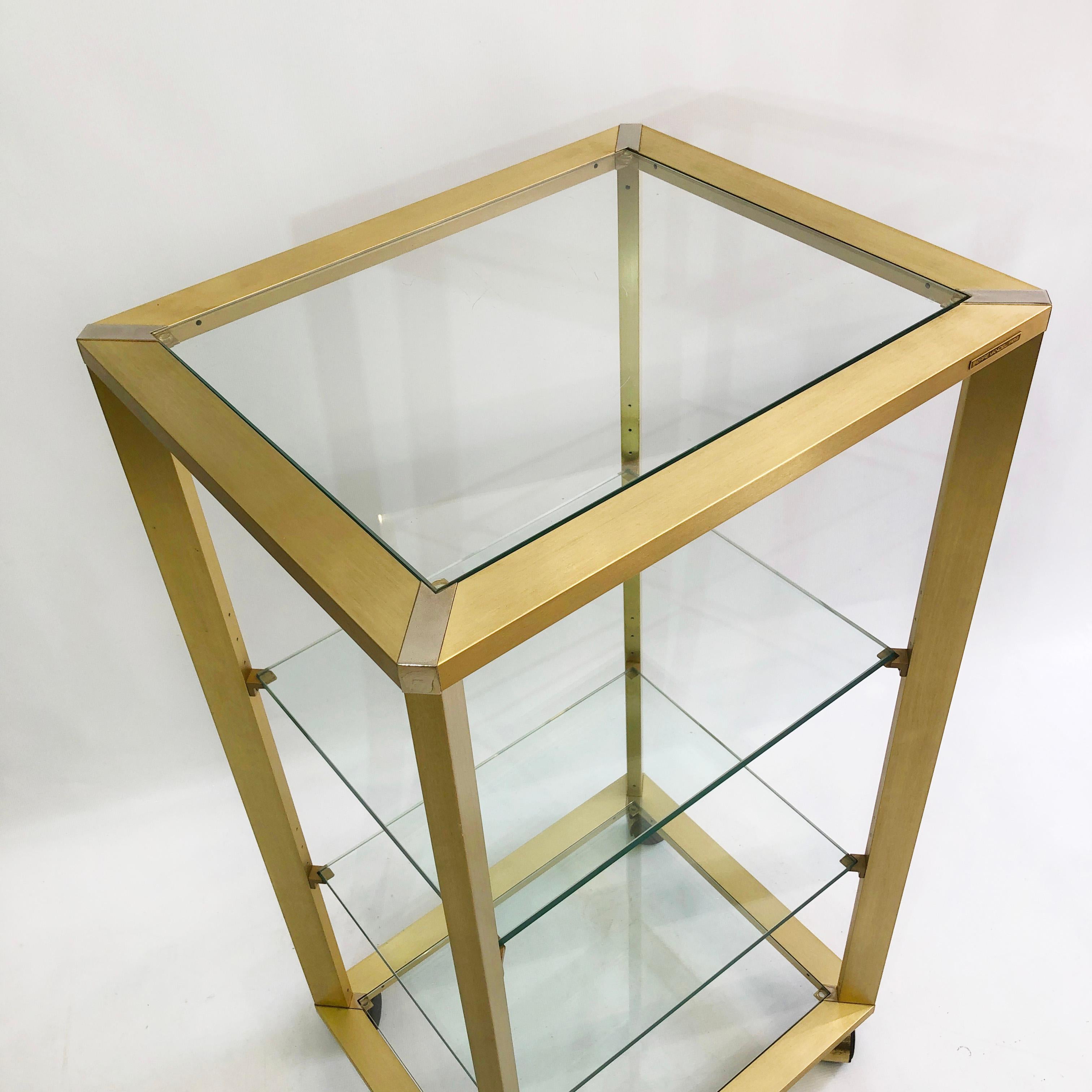 Late 20th Century Pierre Vandel Gold Brass Glass Etagere on Wheels 1970s Drinks Trolley Shelving For Sale